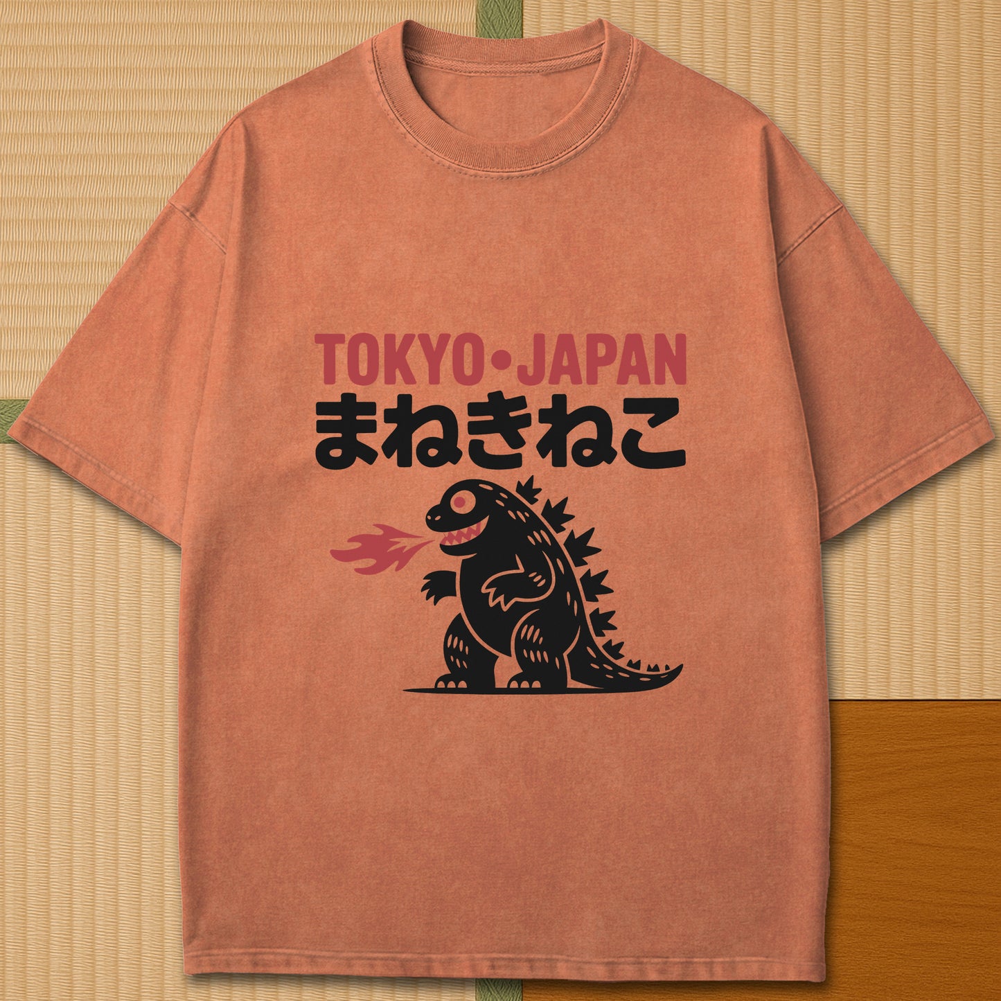Japanese-inspired cotton Maneki Neko Monster T-Shirt in Yam on Comfort Colors 1717, styled in a modern flatlay scene.