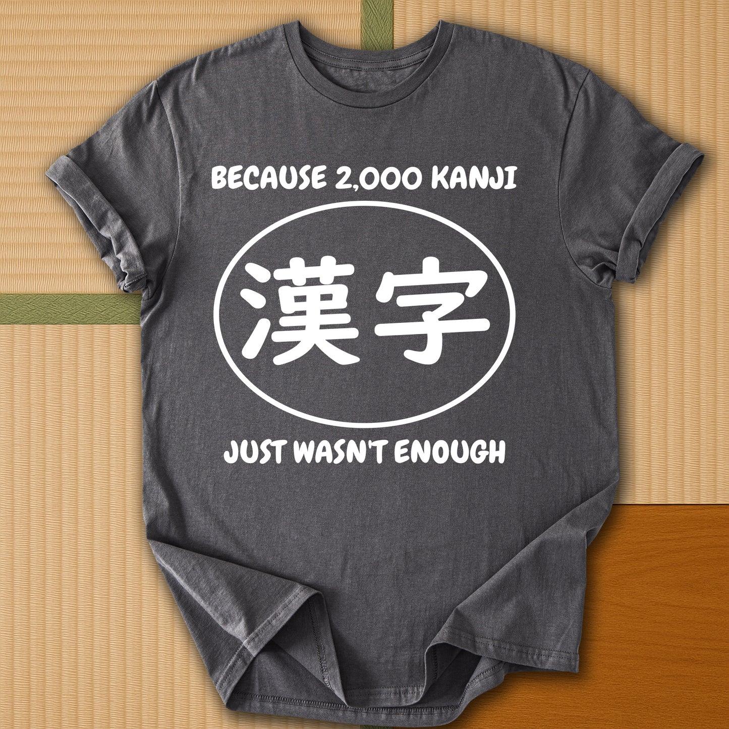 Japanese-inspired cotton Never Enough Kanji T-Shirt in Charcoal on Gildan 64000, styled in a modern flatlay scene