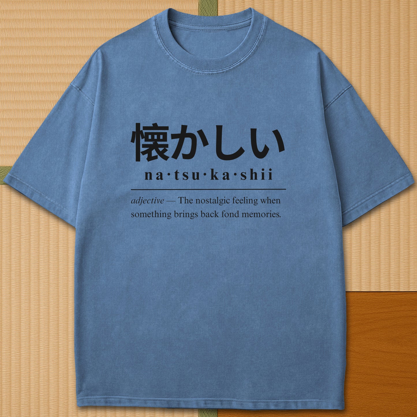 Japanese-inspired cotton Natsukashii Japanese Dictionary T-Shirt in Blue Jean on Comfort Colors 1717, styled in a modern flatlay scene.