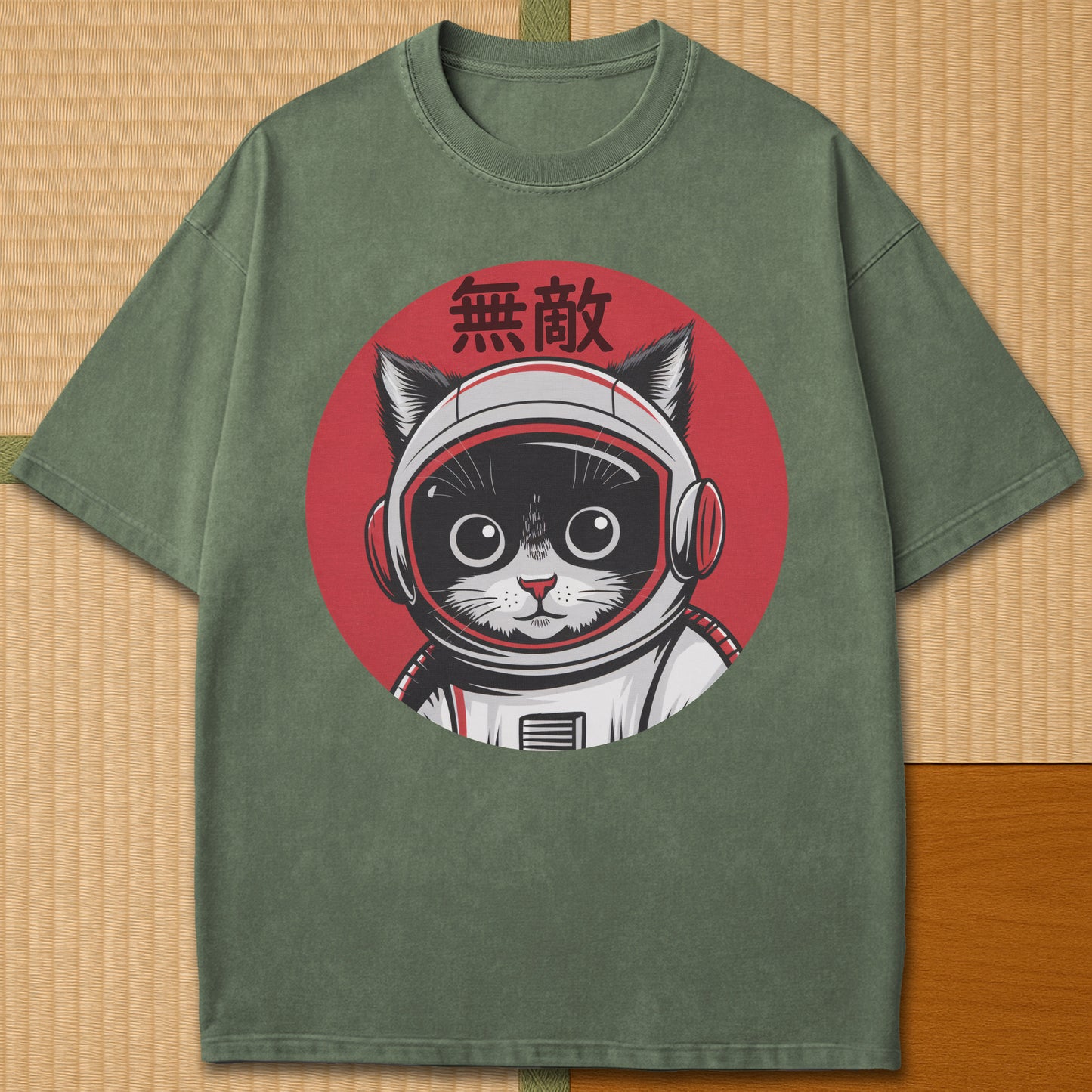 Japanese-inspired cotton Invincible Space Cat T-Shirt in Moss on Comfort Colors 1717, styled in a modern flatlay scene.