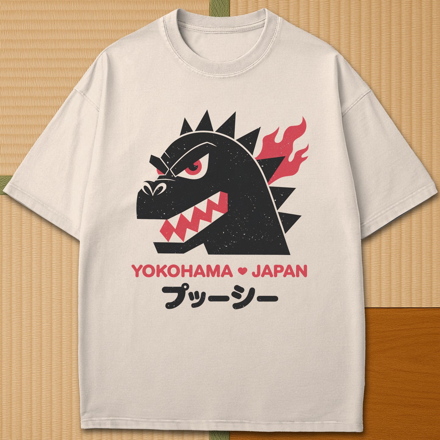 Japanese-inspired cotton Vintage Kaiju Godzilla T-Shirt in Ivory on Comfort Colors 1717, styled in a modern flatlay scene.