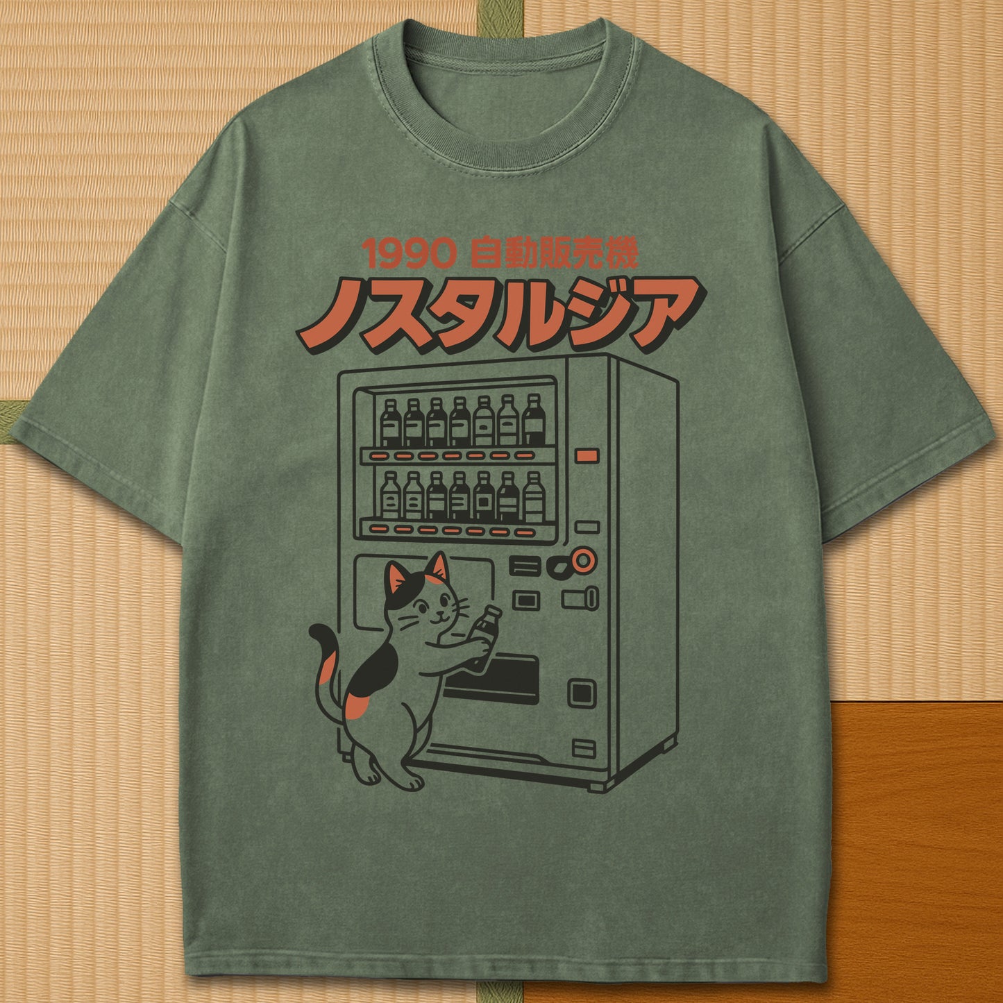 Japanese-inspired cotton Neko Nostalgia T-Shirt in Moss on Comfort Colors 1717, styled in a modern flatlay scene.
