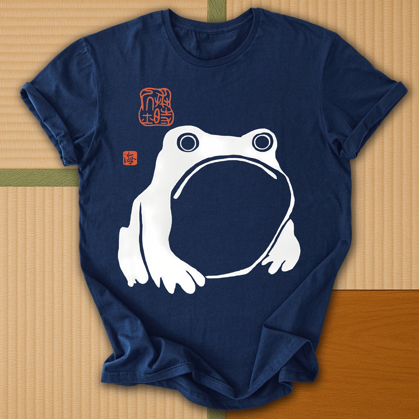 Japanese-inspired cotton Frowning Frog Print T-Shirt in Navy on Gildan 64000, styled in a modern flatlay scene