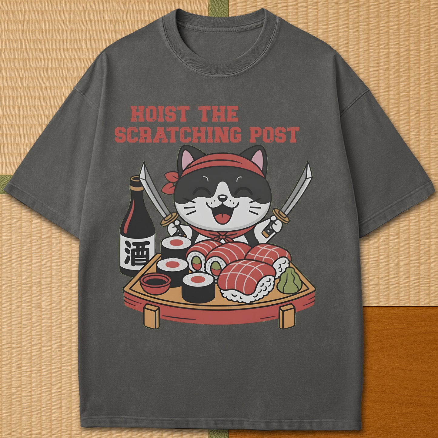 Japanese-inspired cotton Sushi Pirate Hoist The Scratching Post T-Shirt in Pepper on Comfort Colors 1717, styled in a modern flatlay scene.
