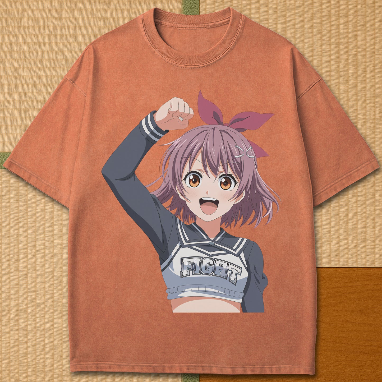 Japanese-inspired cotton Anime Cheerleader T-Shirt in Yam on Comfort Colors 1717, styled in a modern flatlay scene.