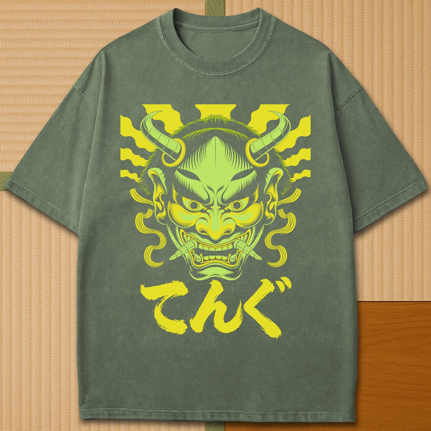 Japanese-inspired cotton Oni Tengu Rising T-Shirt in Moss on Comfort Colors 1717, styled in a modern flatlay scene.