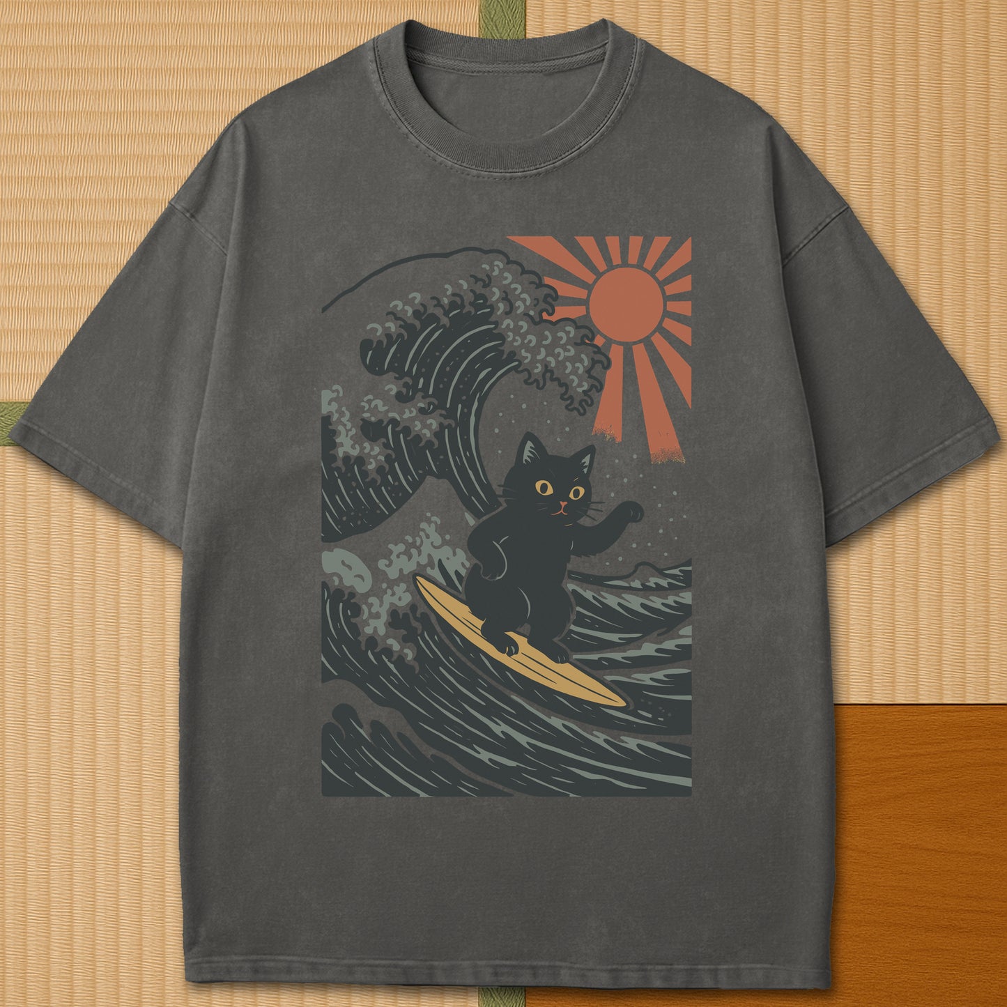 Japanese-inspired cotton Tsunami Surfer Neko T-Shirt in Pepper on Comfort Colors 1717, styled in a modern flatlay scene.