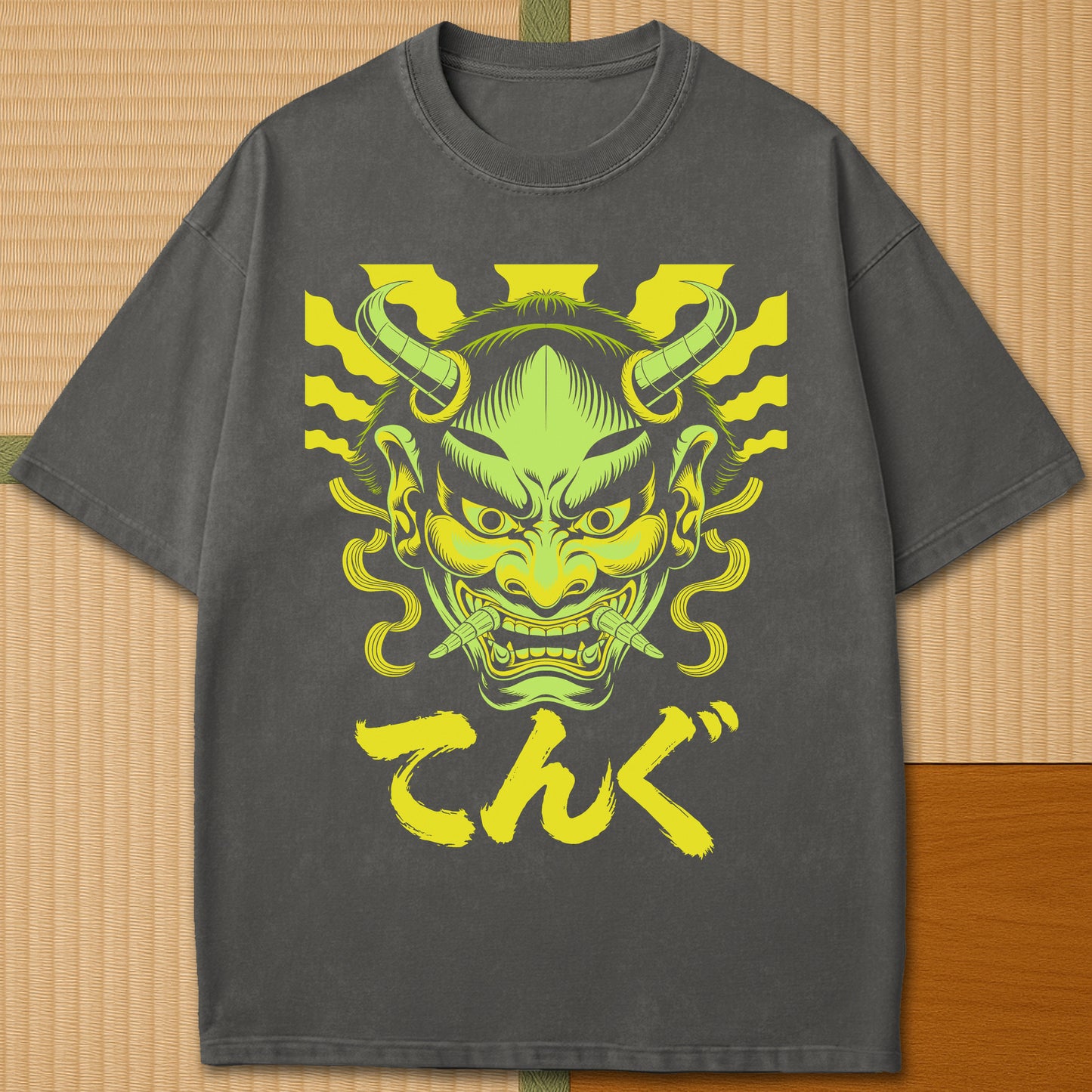 Japanese-inspired cotton Oni Tengu Rising T-Shirt in Pepper on Comfort Colors 1717, styled in a modern flatlay scene.