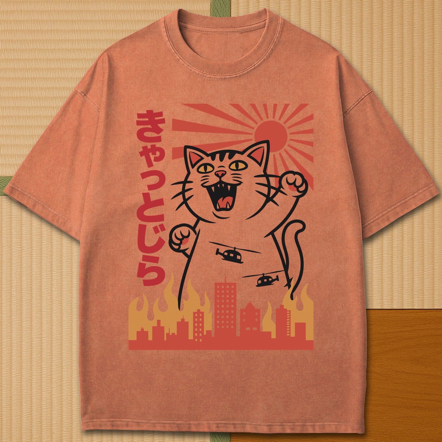 Japanese-inspired cotton Catzilla Rising Sun T-Shirt in Yam on Comfort Colors 1717, styled in a modern flatlay scene.