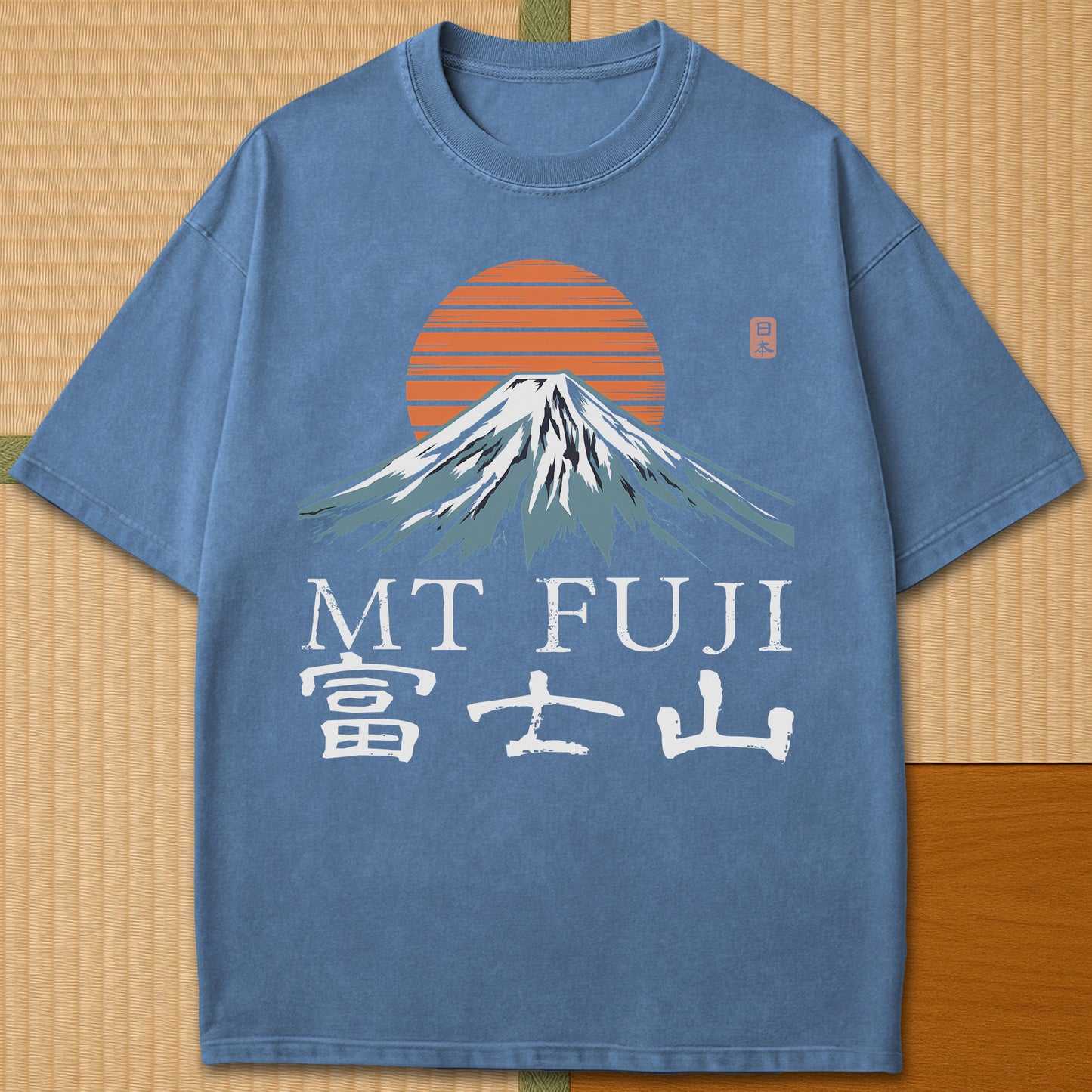 Japanese-inspired cotton Mt Fuji T-Shirt in Blue Jean on Comfort Colors 1717, styled in a modern flatlay scene.