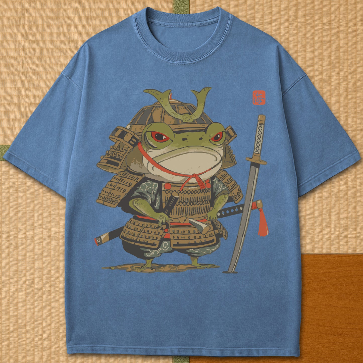 Japanese-inspired cotton Anime Frog Samurai T-Shirt in Blue Jean on Comfort Colors 1717, styled in a modern flatlay scene.
