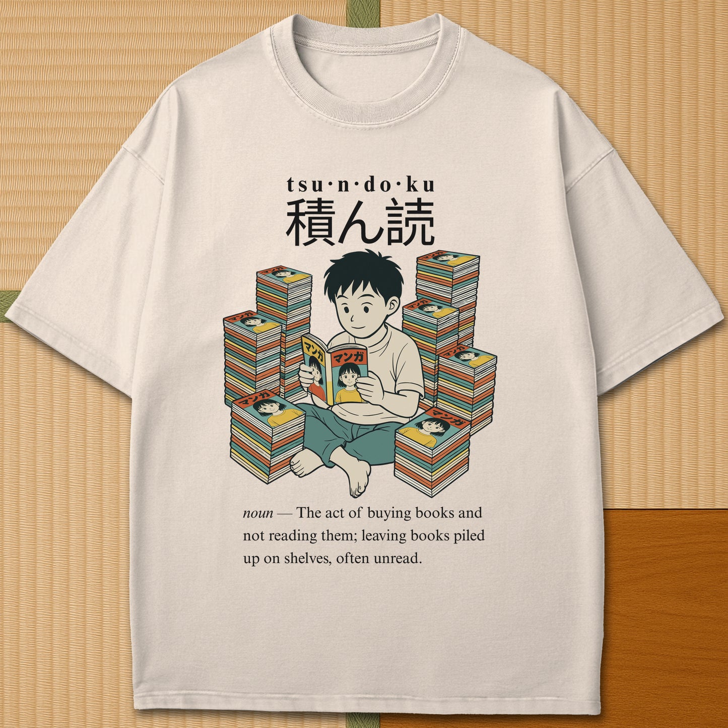 Japanese-inspired cotton Tsundoku Boy Manga Collector T-Shirt in Ivory on Comfort Colors 1717, styled in a modern flatlay scene.