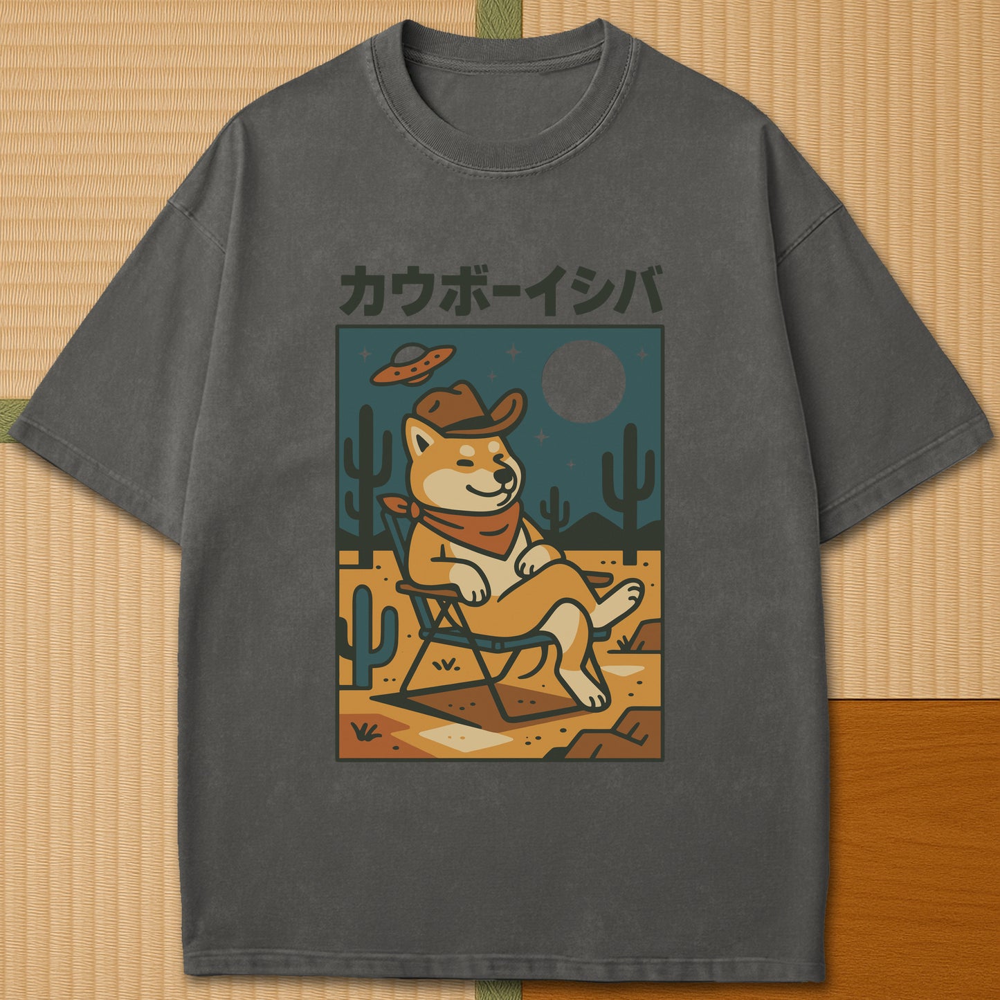 Japanese-inspired cotton Cosmic Cowboy Shiba T-Shirt in Pepper on Comfort Colors 1717, styled in a modern flatlay scene.
