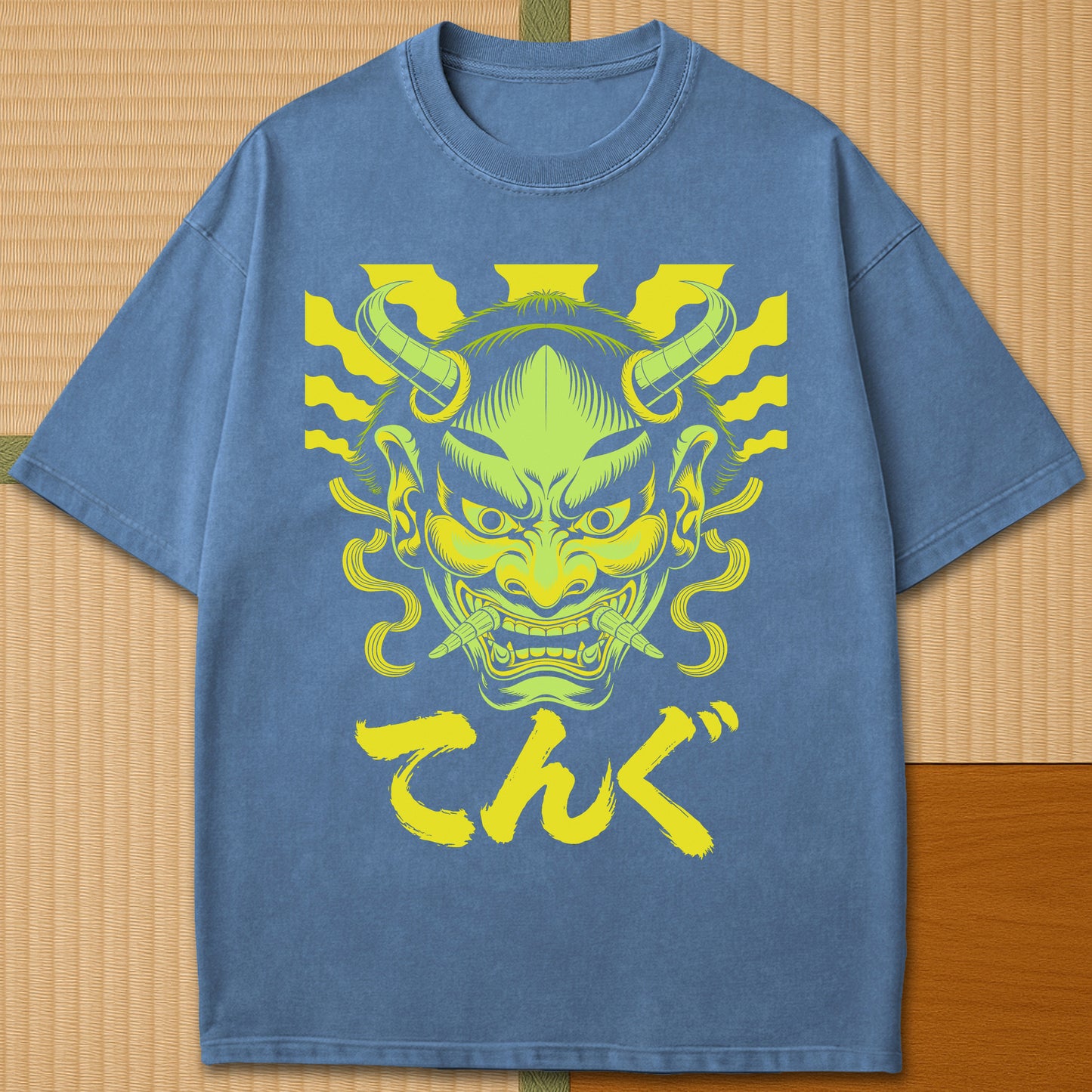 Japanese-inspired cotton Oni Tengu Rising T-Shirt in Blue Jean on Comfort Colors 1717, styled in a modern flatlay scene.