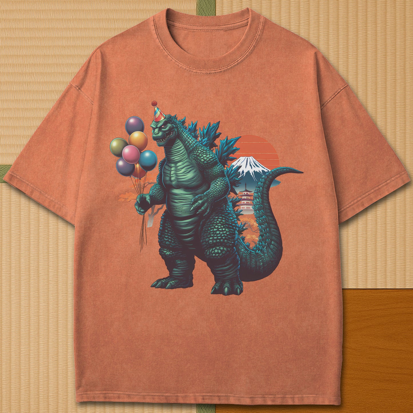 Japanese-inspired cotton Birthday Kaiju T-Shirt in Yam on Comfort Colors 1717, styled in a modern flatlay scene.