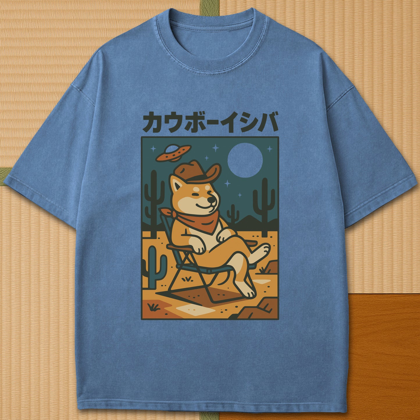 Japanese-inspired cotton Cosmic Cowboy Shiba T-Shirt in Blue Jean on Comfort Colors 1717, styled in a modern flatlay scene.