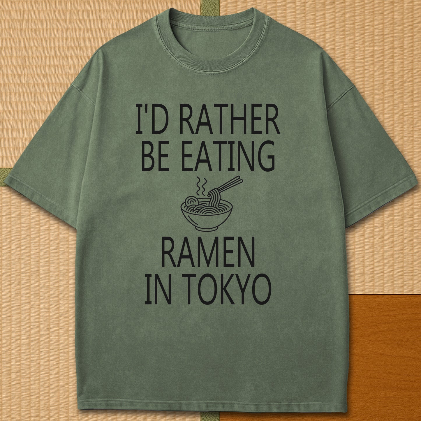 Japanese-inspired cotton Rather Be Eating Ramen T-Shirt in Moss on Comfort Colors 1717, styled in a modern flatlay scene.
