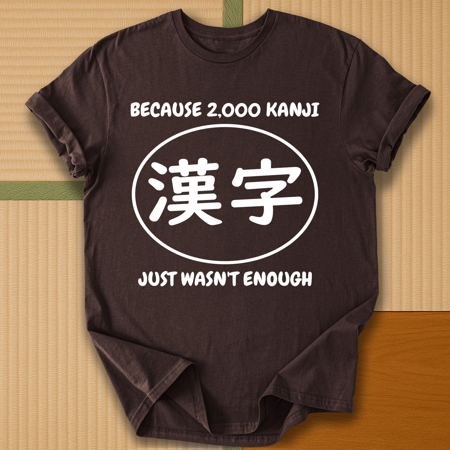 Japanese-inspired cotton Never Enough Kanji T-Shirt in Dark Chocolate on Gildan 64000, styled in a modern flatlay scene