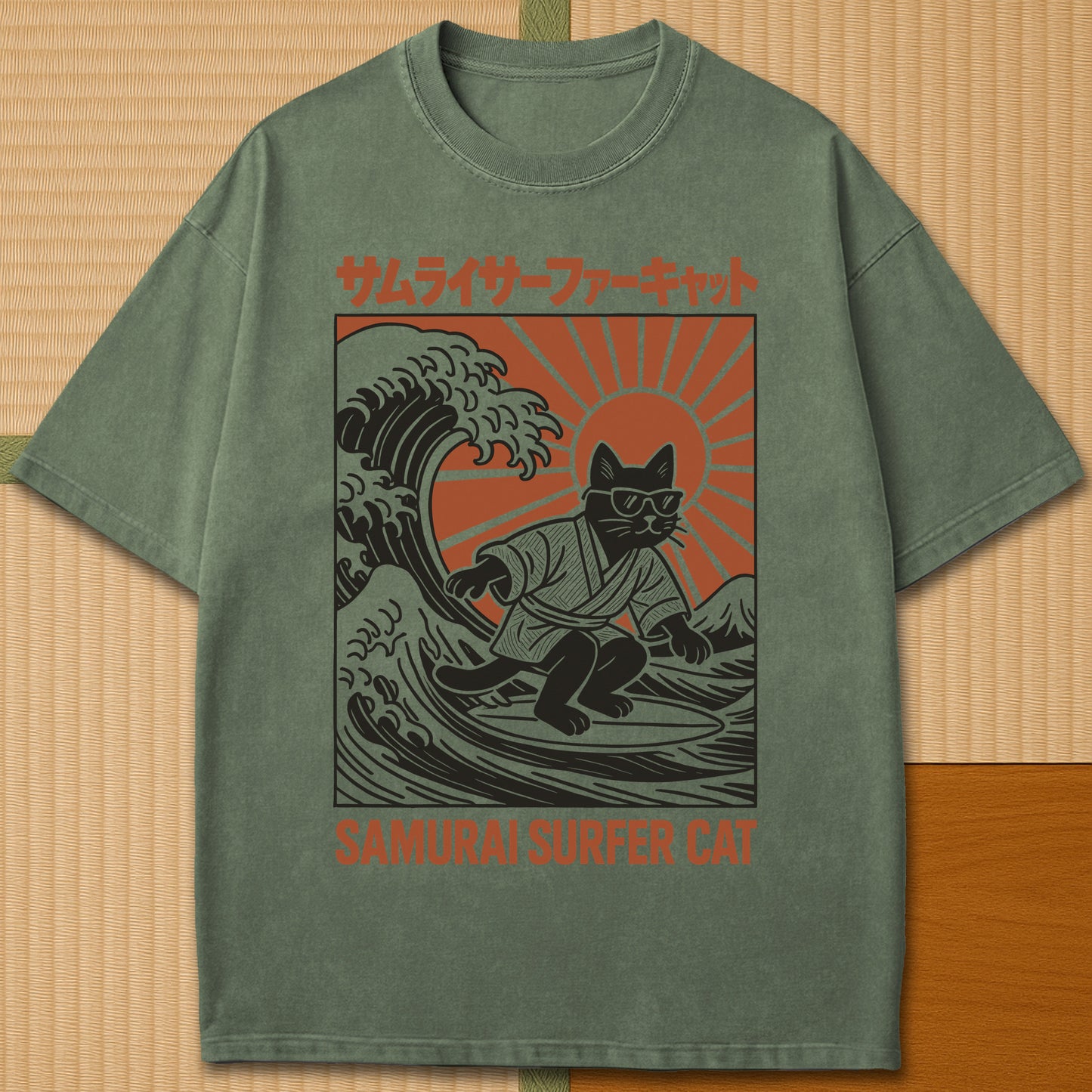 Japanese-inspired cotton Samurai Surfer Cat T-Shirt in Moss on Comfort Colors 1717, styled in a modern flatlay scene.