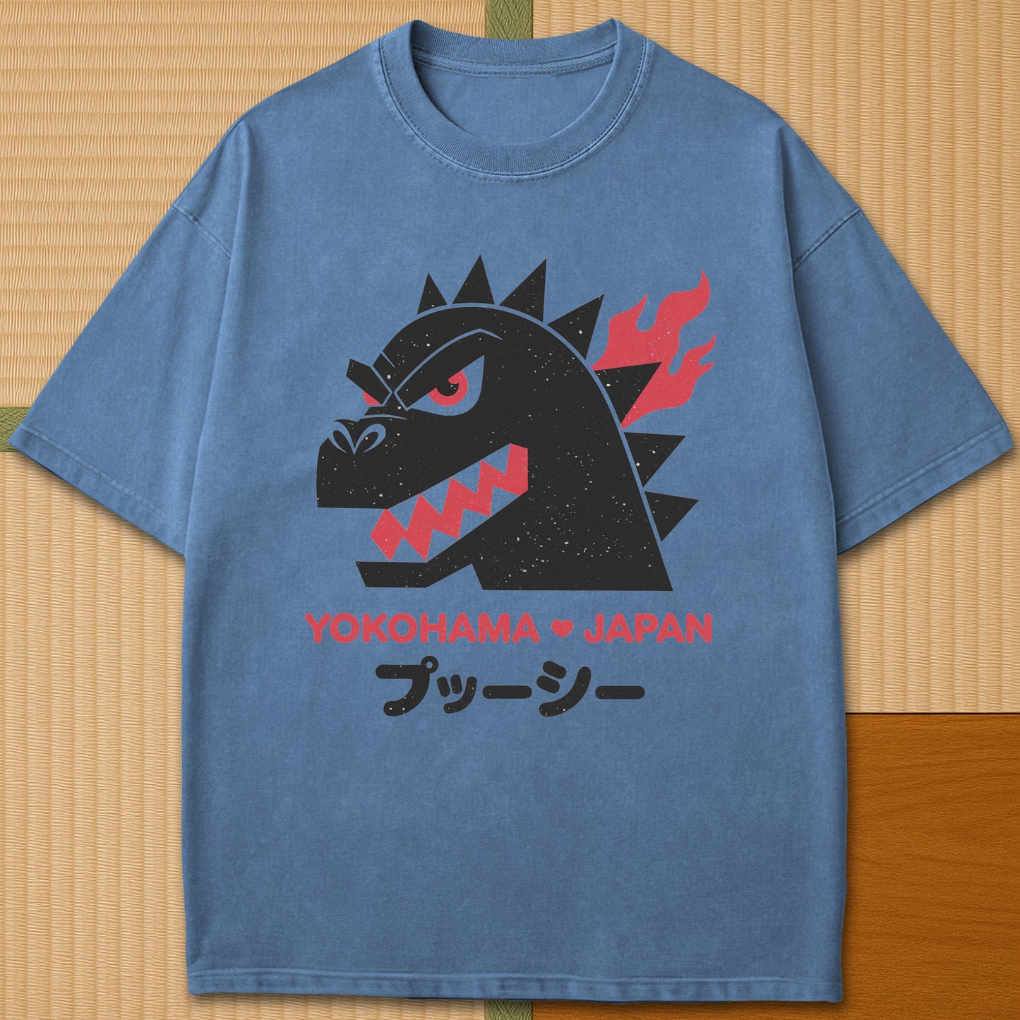 Japanese-inspired cotton Vintage Kaiju Godzilla T-Shirt in Blue Jean on Comfort Colors 1717, styled in a modern flatlay scene.