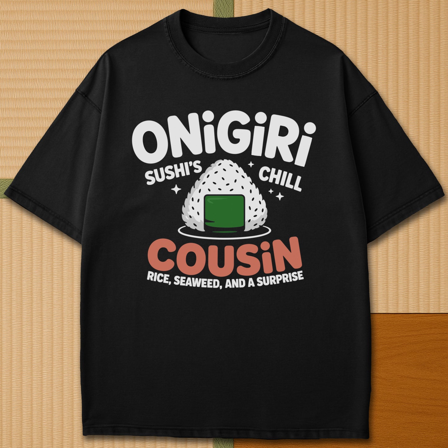 Japanese-inspired cotton Sushis Chill Cousin Onigiri T-Shirt in Black on Comfort Colors 1717, styled in a modern flatlay scene.