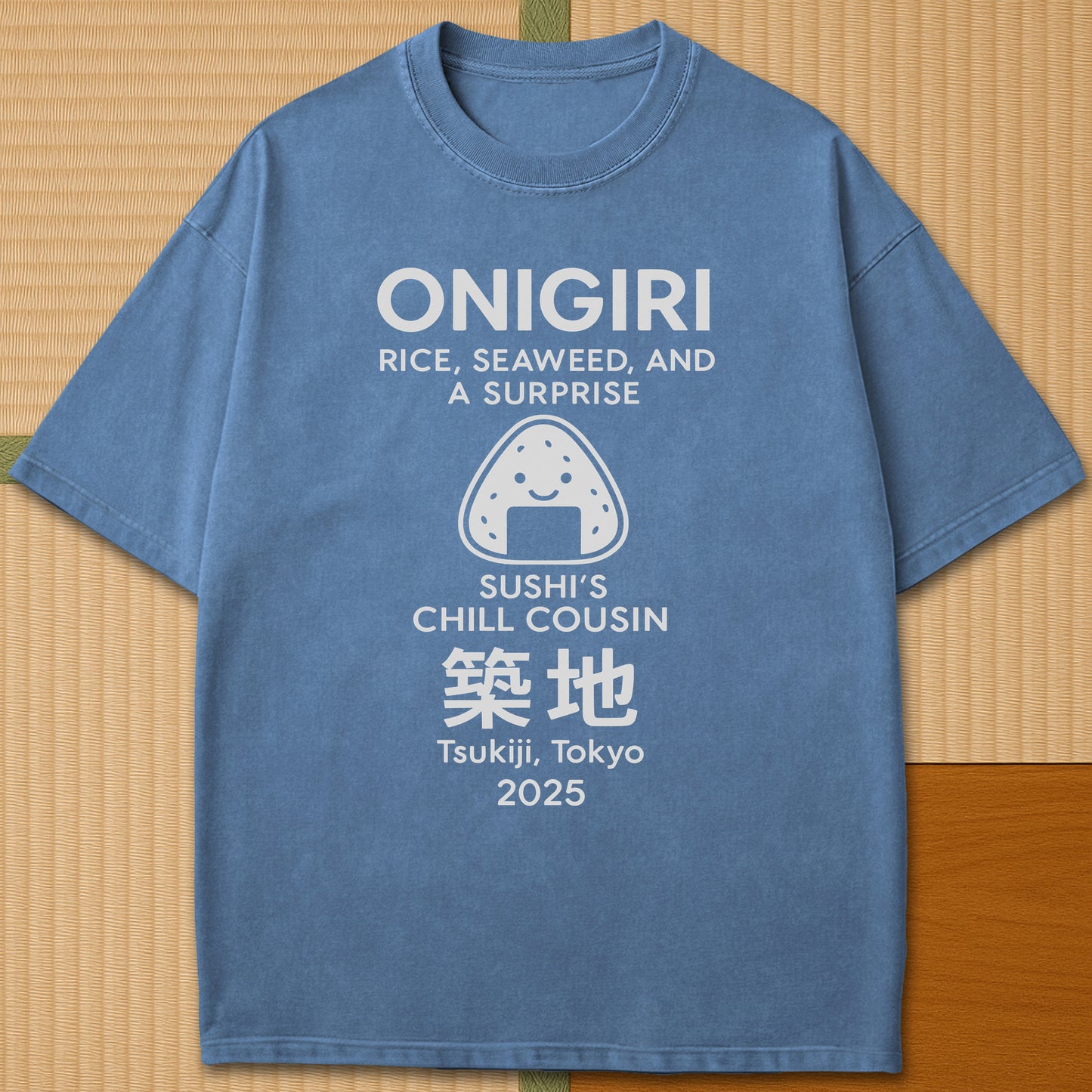 Japanese-inspired cotton Onigiri Chill Cousin Of Sushi T-Shirt in Blue Jean on Comfort Colors 1717, styled in a modern flatlay scene.