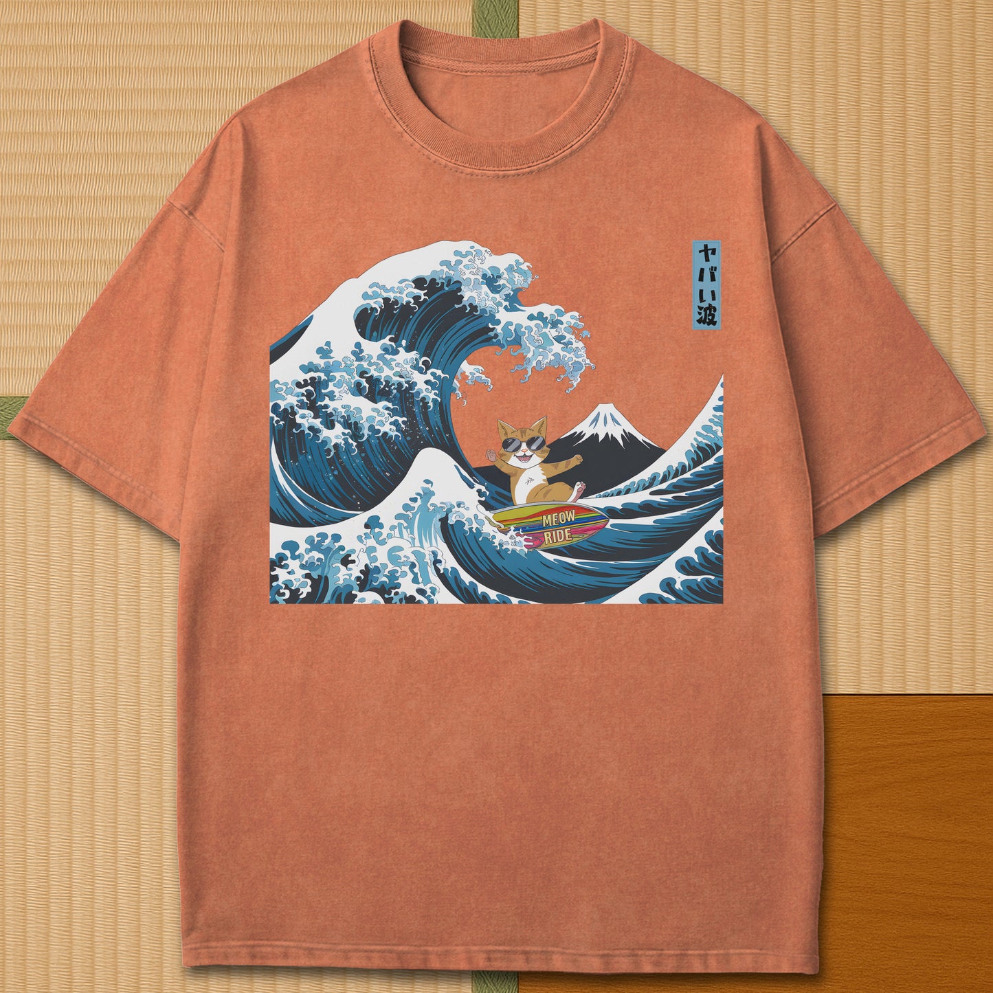Japanese-inspired cotton Meow Ride T-Shirt in Yam on Comfort Colors 1717, styled in a modern flatlay scene.