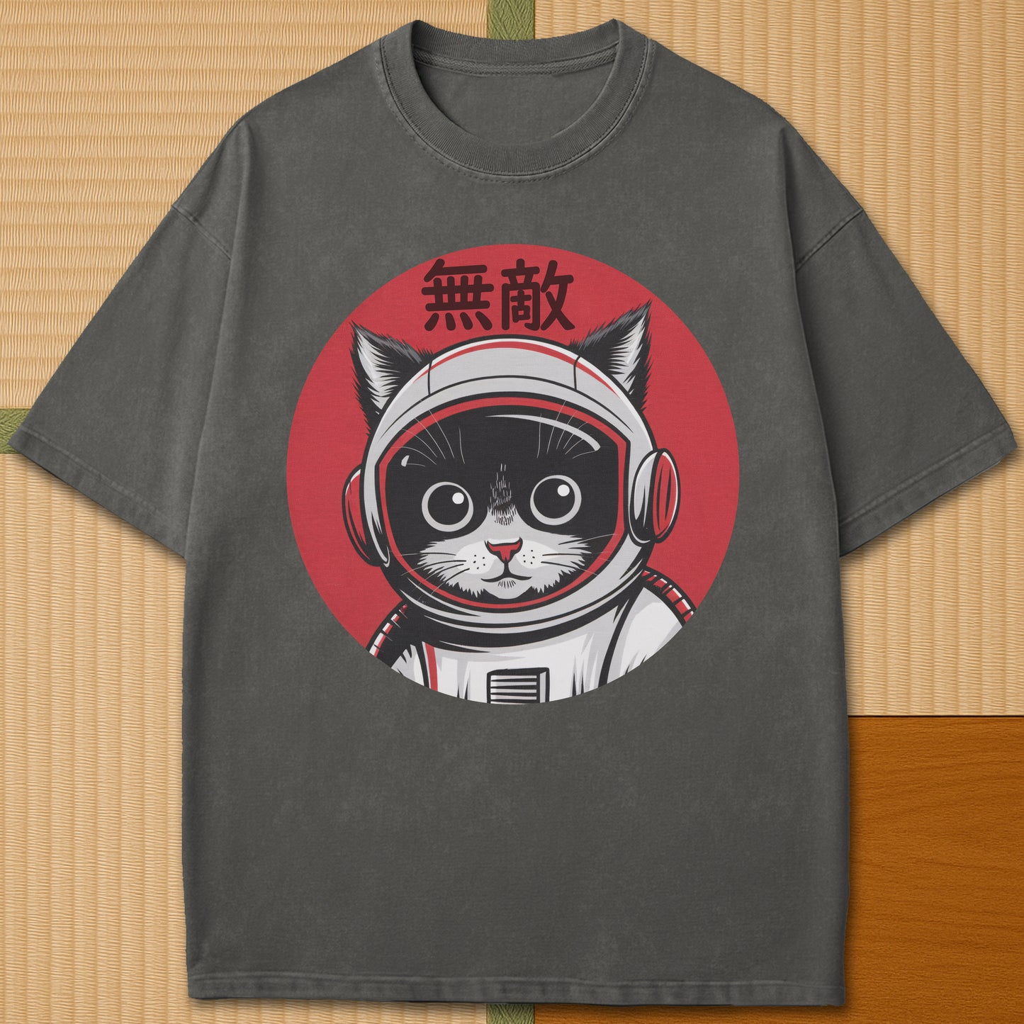Japanese-inspired cotton Invincible Space Cat T-Shirt in Pepper on Comfort Colors 1717, styled in a modern flatlay scene.
