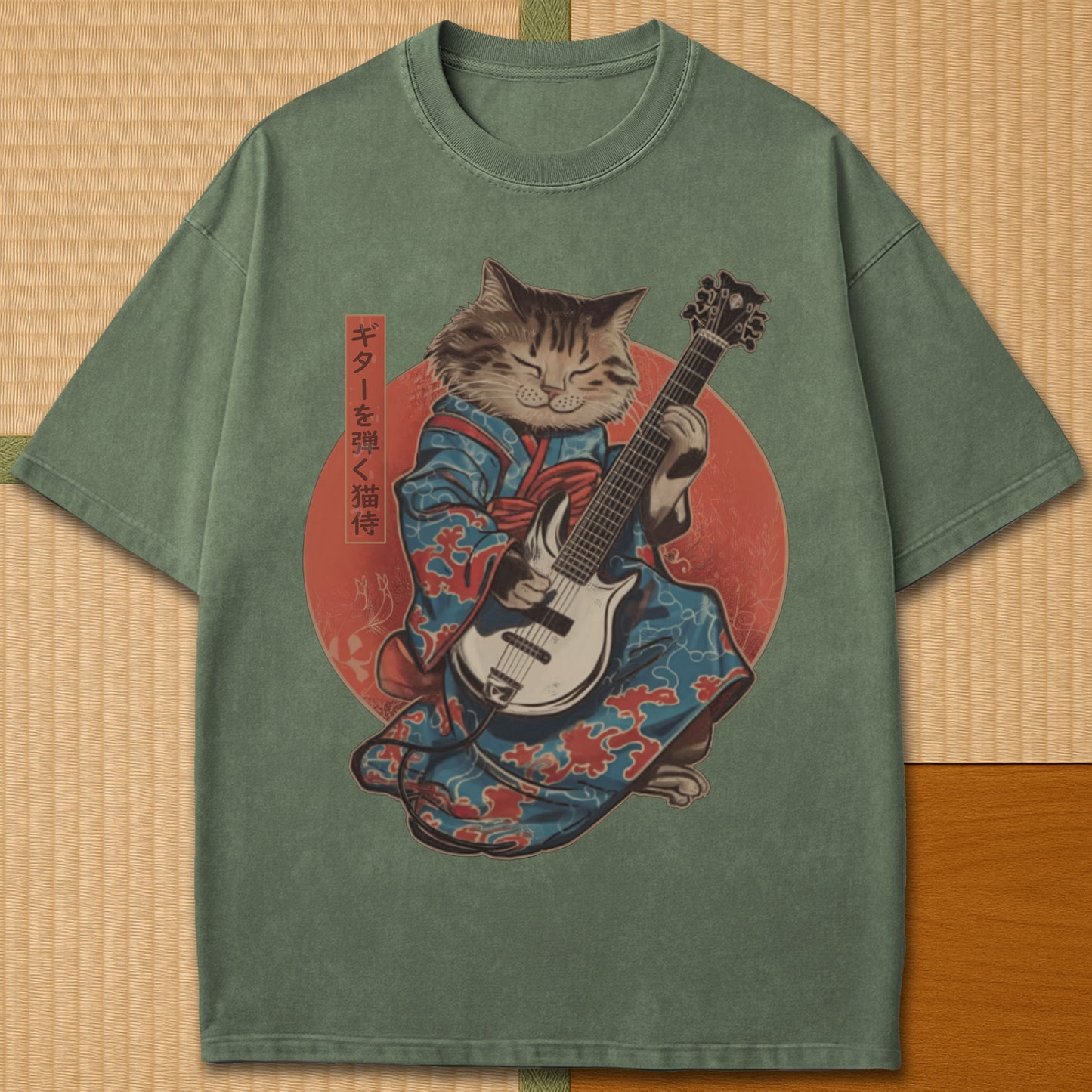 Japanese-inspired cotton Samurai Cat On Guitar T-Shirt in Moss on Comfort Colors 1717, styled in a modern flatlay scene.