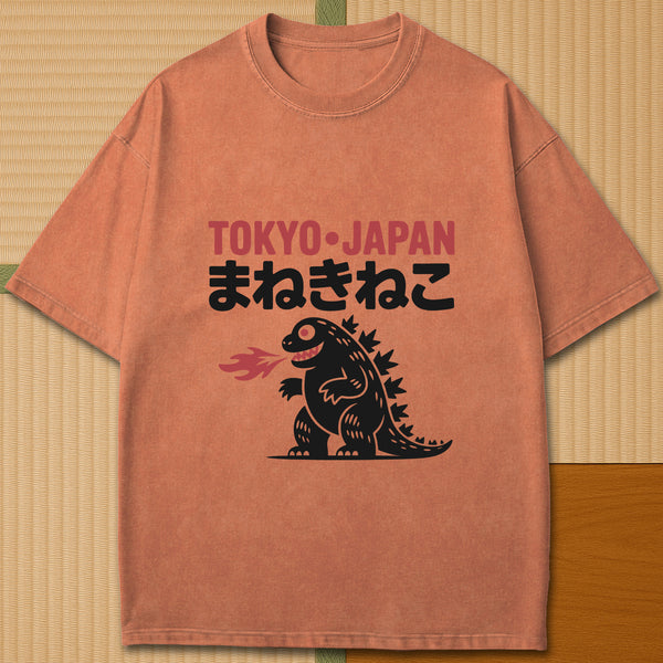 Japanese-inspired cotton Maneki Neko Monster T-Shirt in Yam on Comfort Colors 1717, styled in a modern flatlay scene.