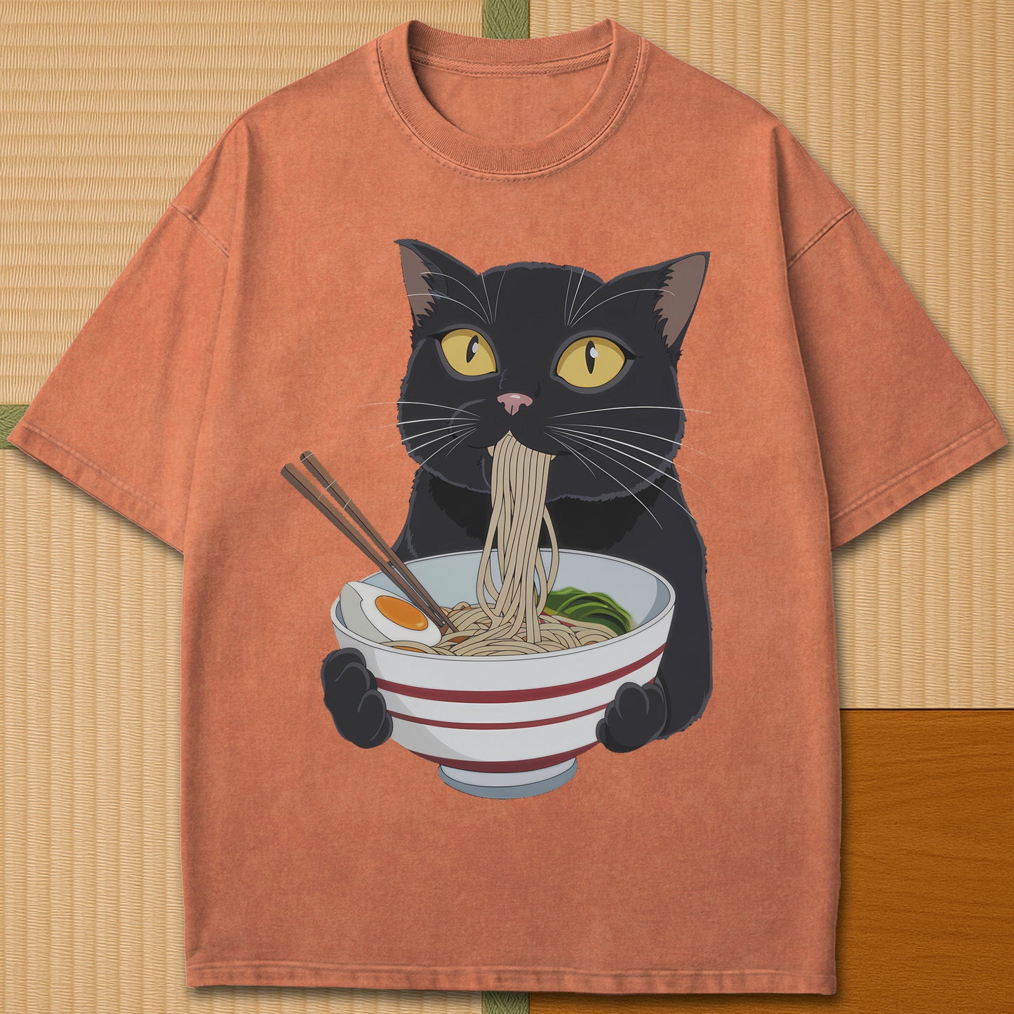 Japanese-inspired cotton Cat Eats Ramen T-Shirt in Yam on Comfort Colors 1717, styled in a modern flatlay scene.