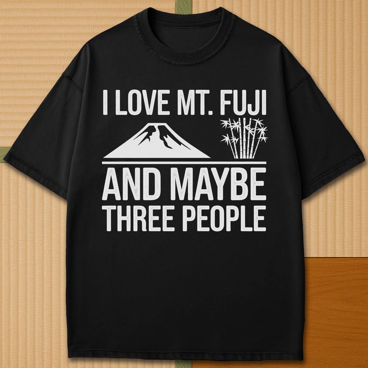 Japanese-inspired cotton I Love Mt Fuji And Maybe Three People T-Shirt in Black on Comfort Colors 1717, styled in a modern flatlay scene.