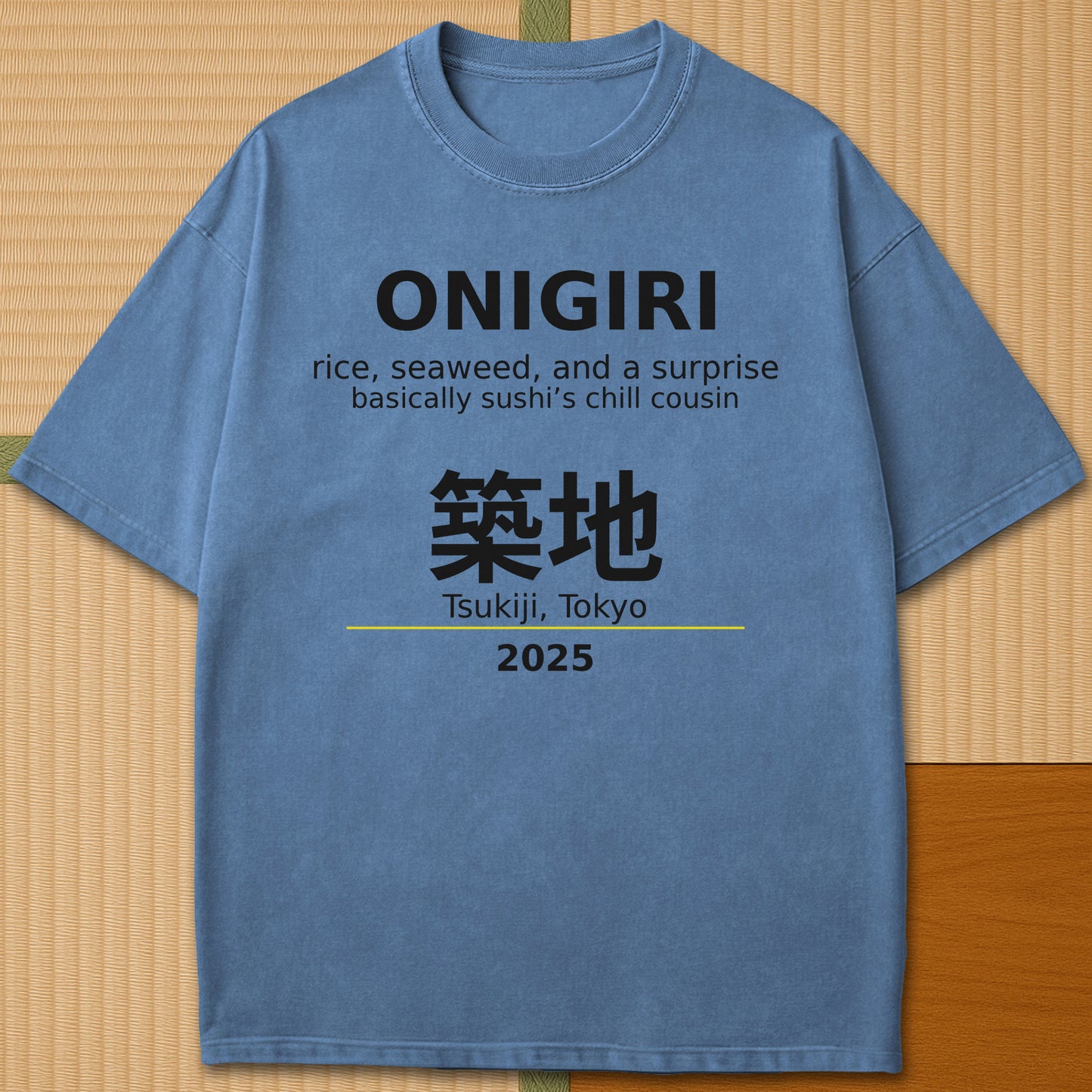 Japanese-inspired cotton Onigiri Tsukiji T-Shirt in Blue Jean on Comfort Colors 1717, styled in a modern flatlay scene.