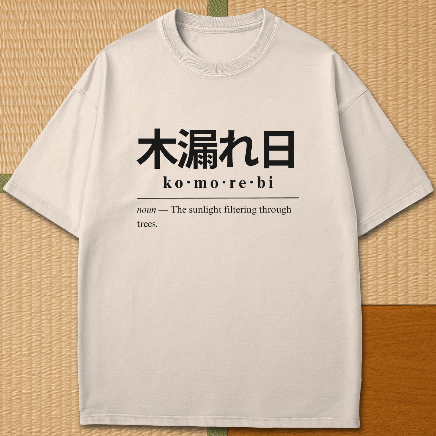 Japanese-inspired cotton Komorebi Japanese Dictionary T-Shirt in Ivory on Comfort Colors 1717, styled in a modern flatlay scene.