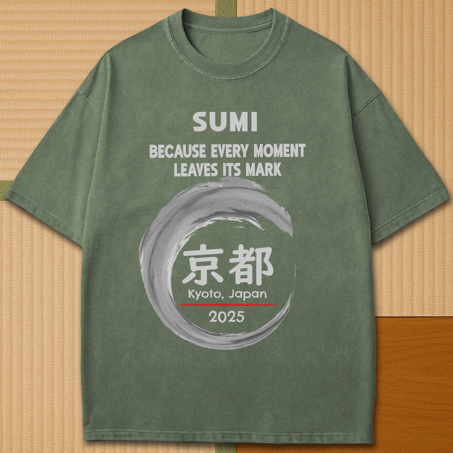 Japanese-inspired cotton Sumi Marks Kyoto T-Shirt in Moss on Comfort Colors 1717, styled in a modern flatlay scene.