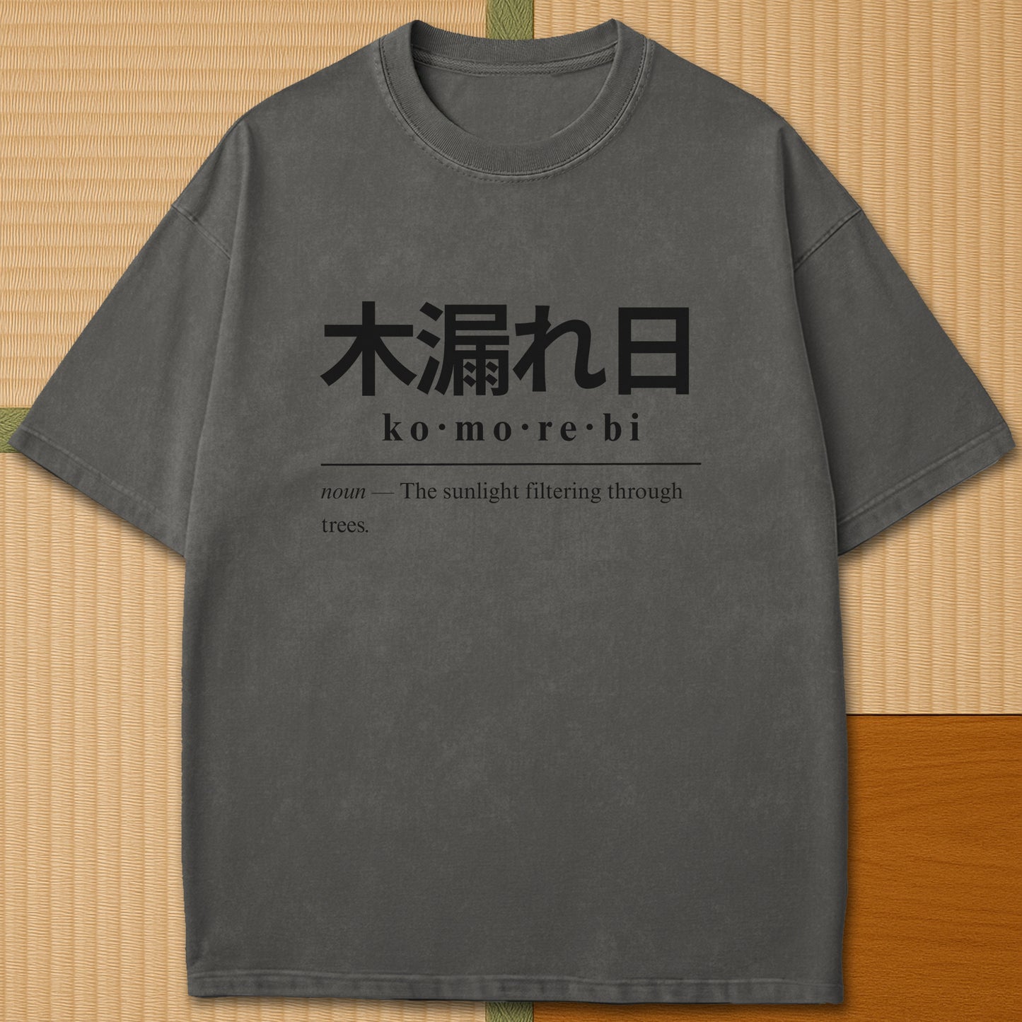Japanese-inspired cotton Komorebi Japanese Dictionary T-Shirt in Pepper on Comfort Colors 1717, styled in a modern flatlay scene.
