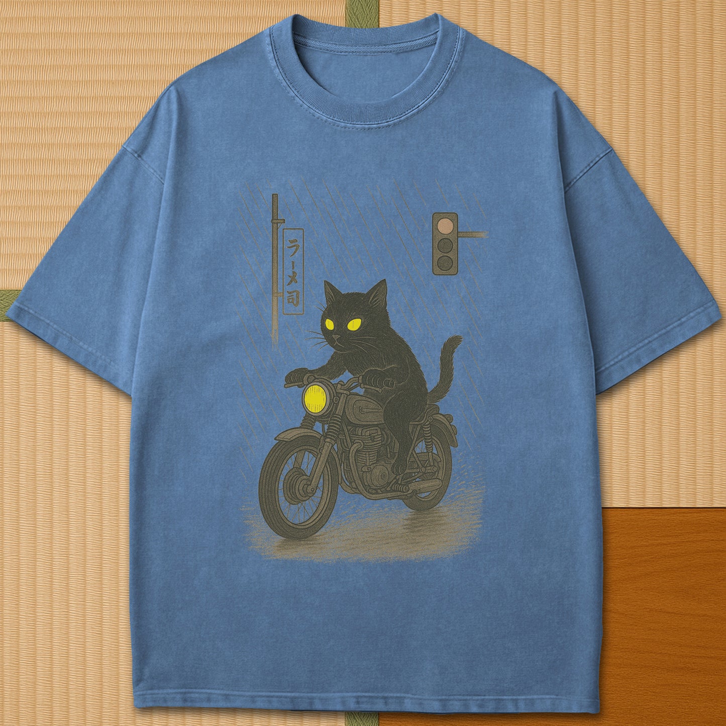 Japanese-inspired cotton Midnight Rain Cat Rider T-Shirt in Blue Jean on Comfort Colors 1717, styled in a modern flatlay scene.
