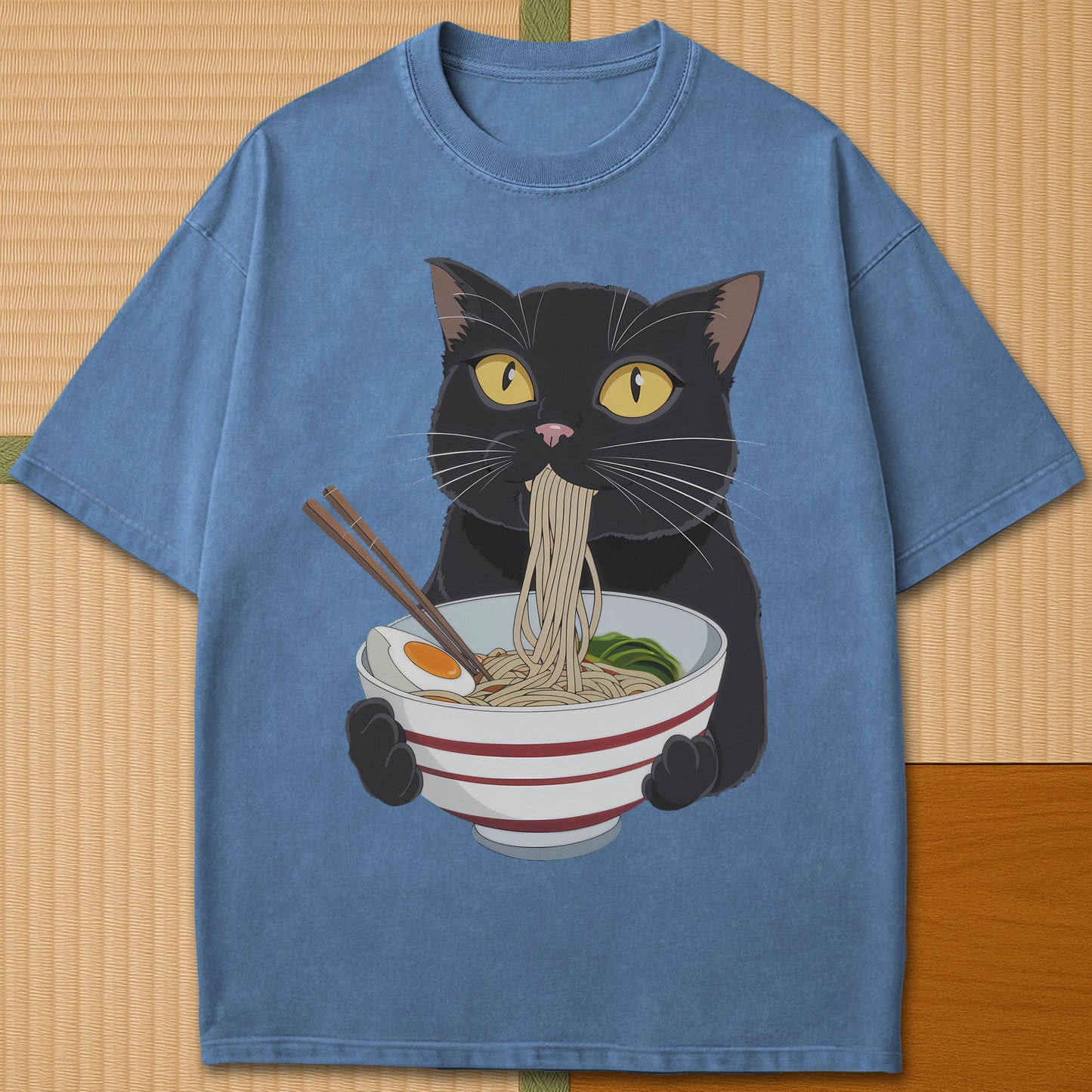 Japanese-inspired cotton Cat Eats Ramen T-Shirt in Blue Jean on Comfort Colors 1717, styled in a modern flatlay scene.