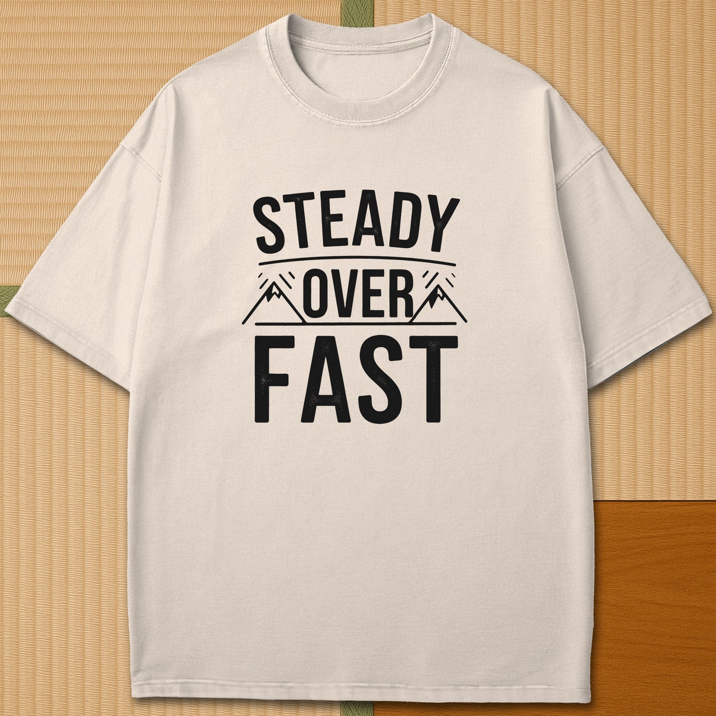 Japanese-inspired cotton Steady Over Fast T-Shirt in Ivory on Comfort Colors 1717, styled in a modern flatlay scene.