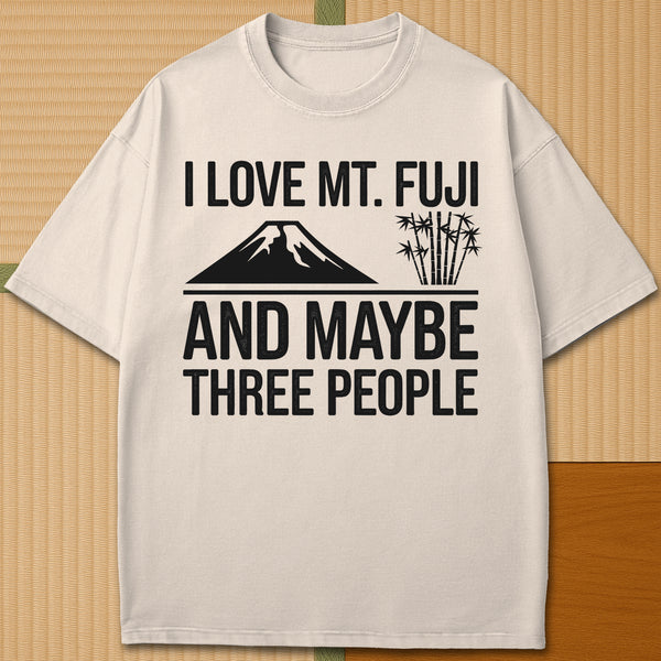 Japanese-inspired cotton I Love Mt Fuji And Maybe Three People T-Shirt in Ivory on Comfort Colors 1717, styled in a modern flatlay scene.