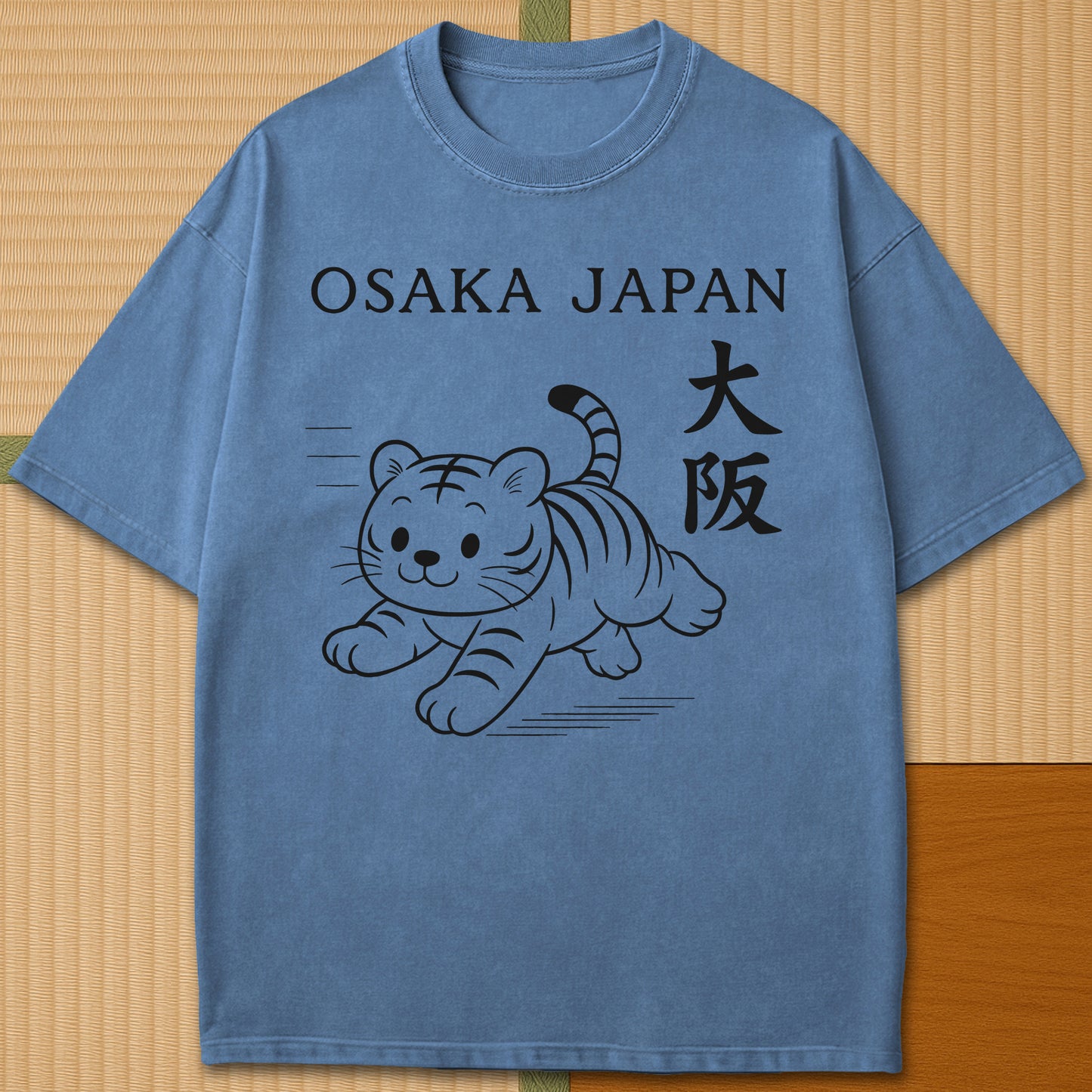 Japanese-inspired cotton Osaka Tiger T-Shirt in Blue Jean on Comfort Colors 1717, styled in a modern flatlay scene.