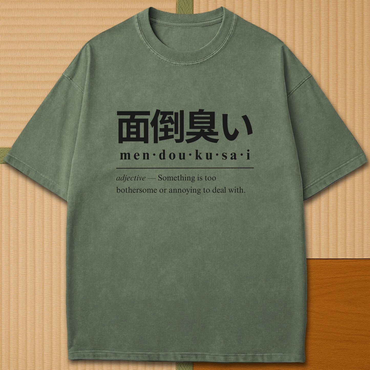 Japanese-inspired cotton Mendoukusai Japanese Dictionary T-Shirt in Moss on Comfort Colors 1717, styled in a modern flatlay scene.