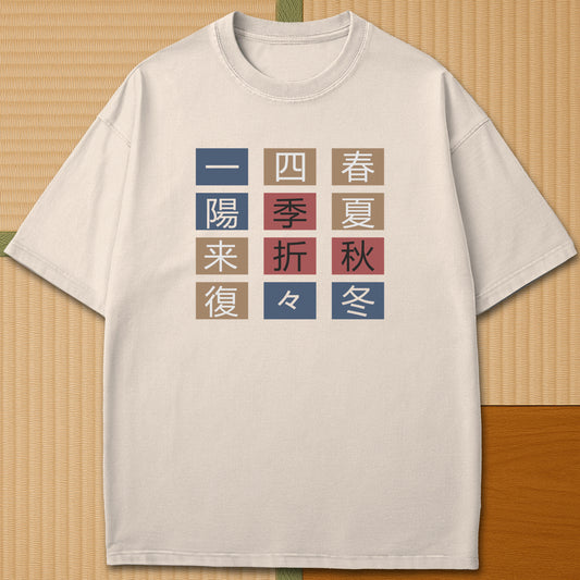 Japanese-inspired cotton The Seasons T-Shirt in Ivory on Comfort Colors 1717, styled in a modern flatlay scene.