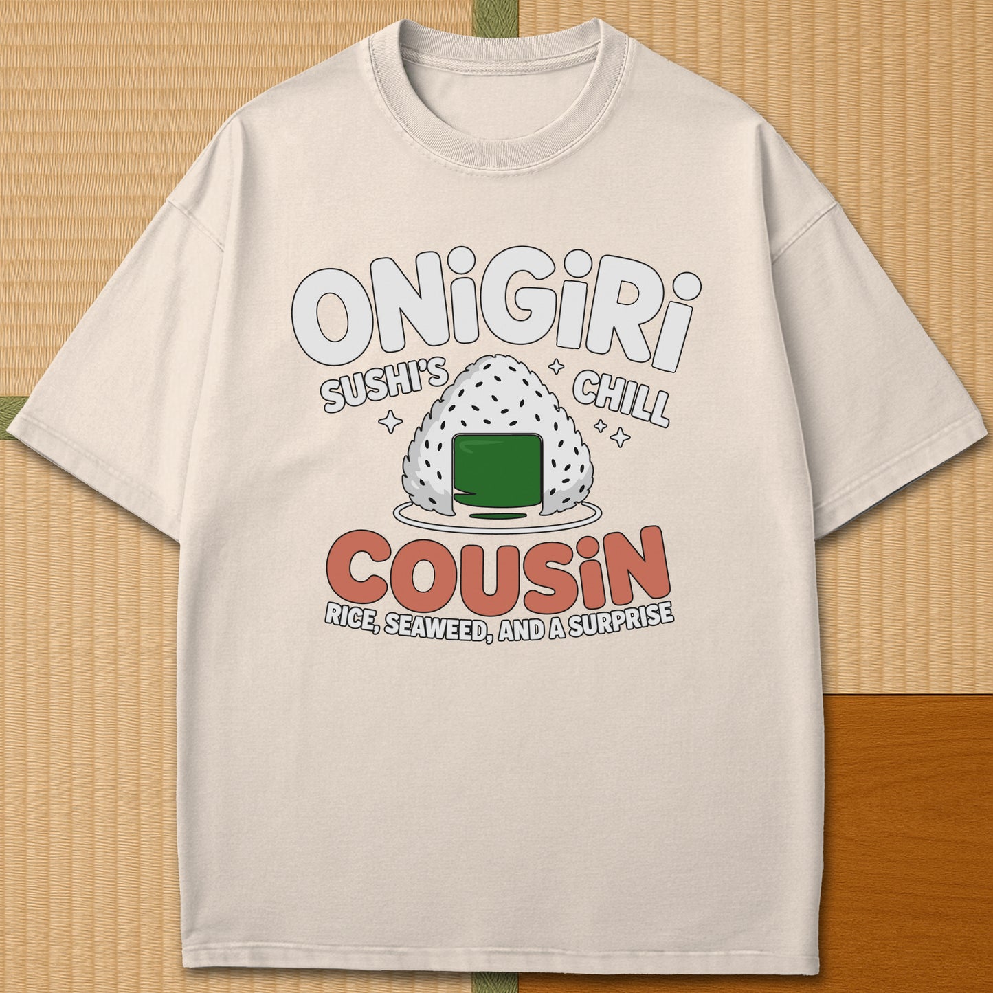 Japanese-inspired cotton Sushis Chill Cousin Onigiri T-Shirt in Ivory on Comfort Colors 1717, styled in a modern flatlay scene.
