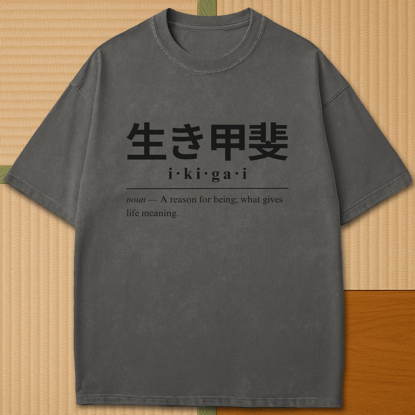 Japanese-inspired cotton Ikigai Japanese Dictionary T-Shirt in Pepper on Comfort Colors 1717, styled in a modern flatlay scene.
