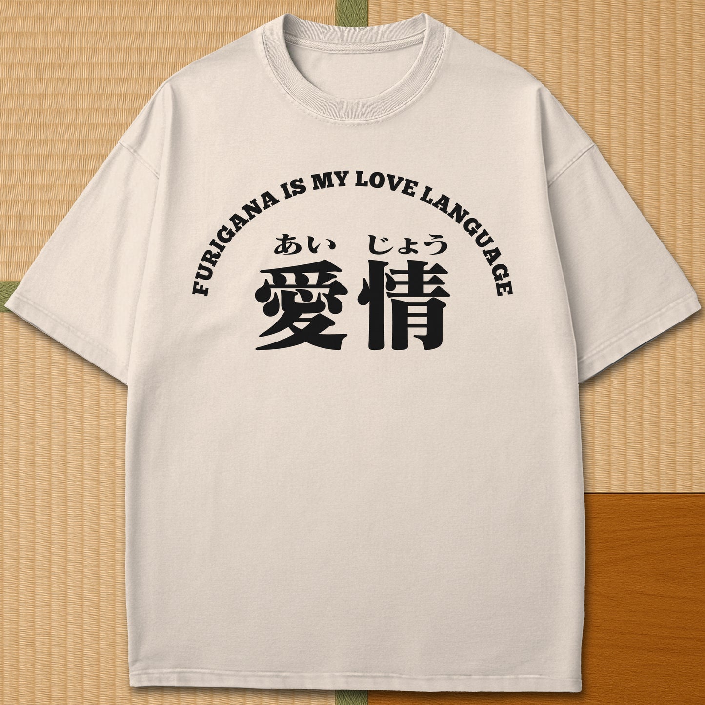 Japanese-inspired cotton Furigana Love Language T-Shirt in Ivory on Comfort Colors 1717, styled in a modern flatlay scene.