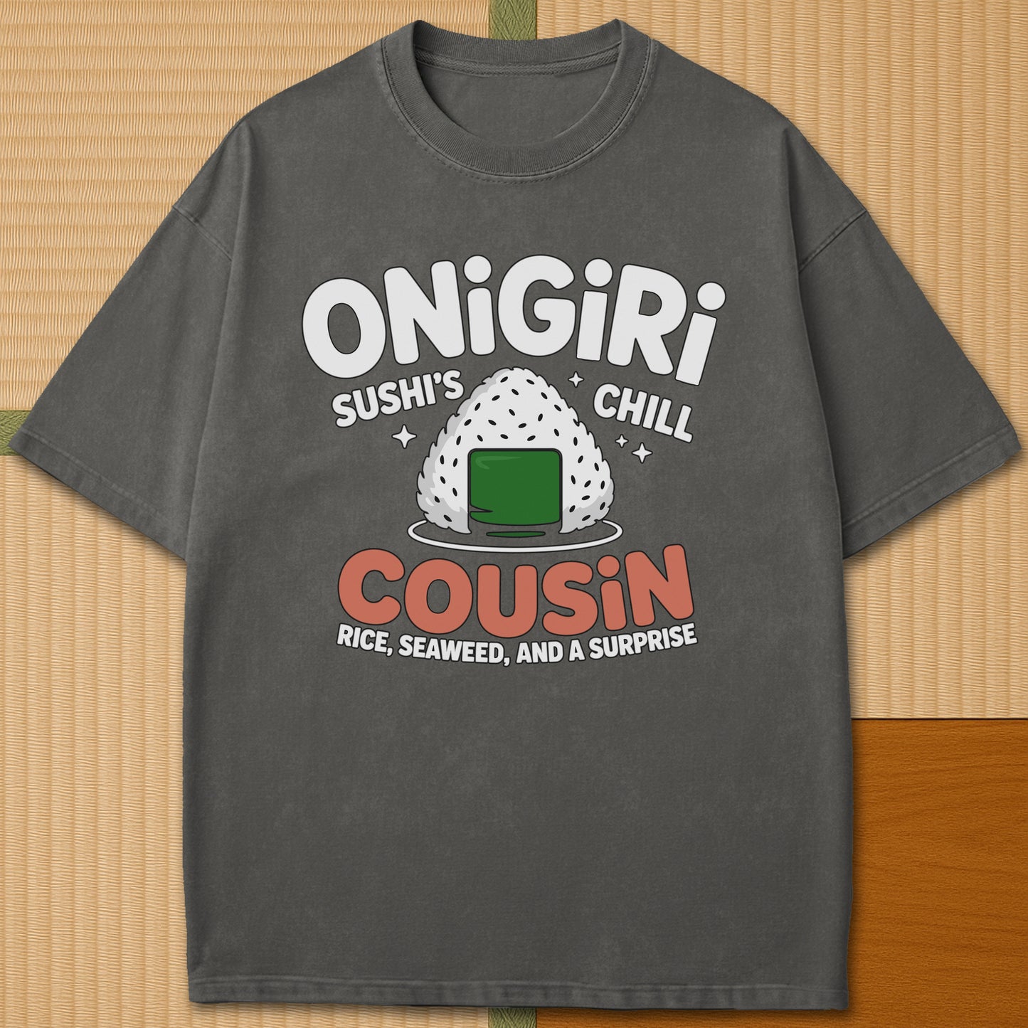 Japanese-inspired cotton Sushis Chill Cousin Onigiri T-Shirt in Pepper on Comfort Colors 1717, styled in a modern flatlay scene.