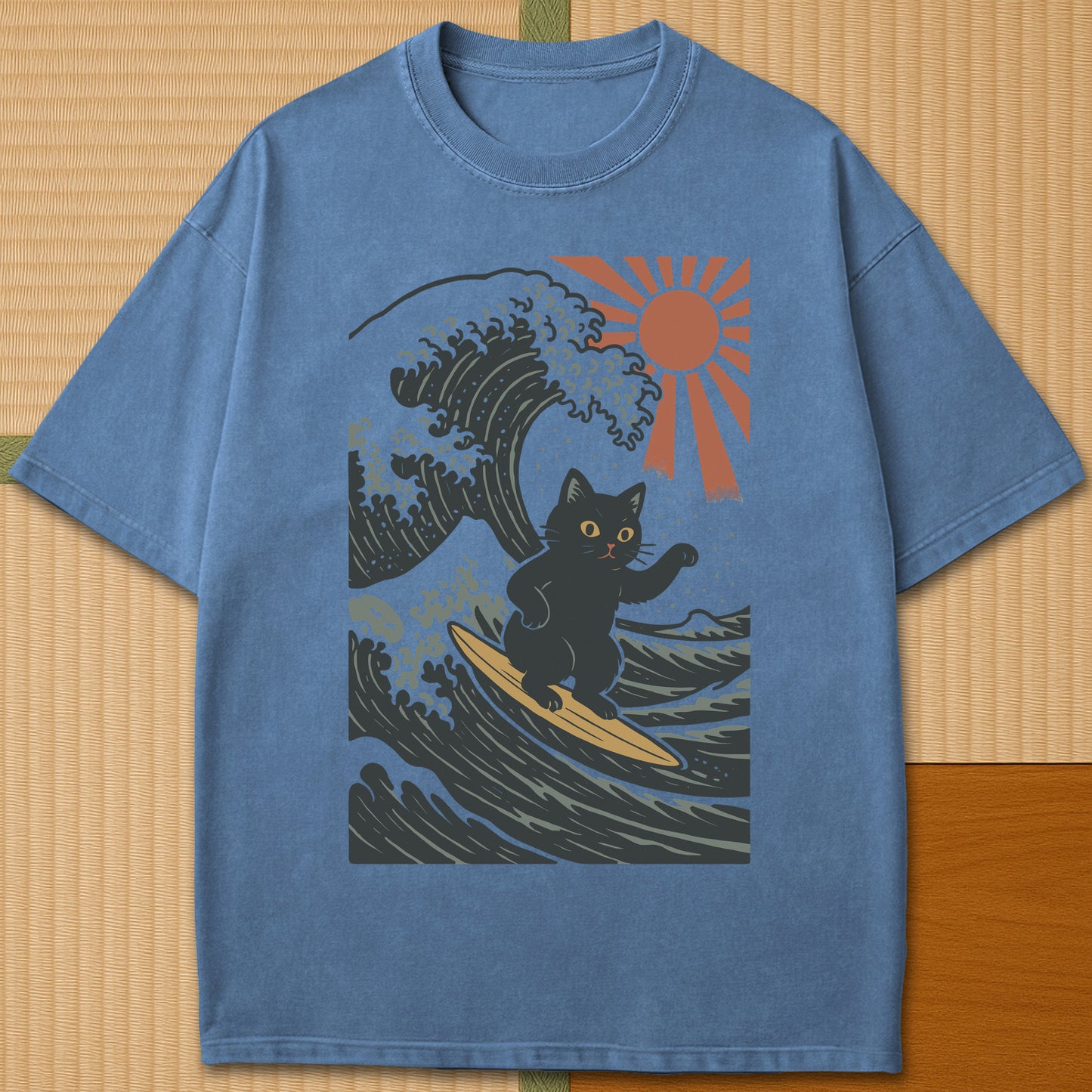 Japanese-inspired cotton Tsunami Surfer Neko T-Shirt in Blue Jean on Comfort Colors 1717, styled in a modern flatlay scene.