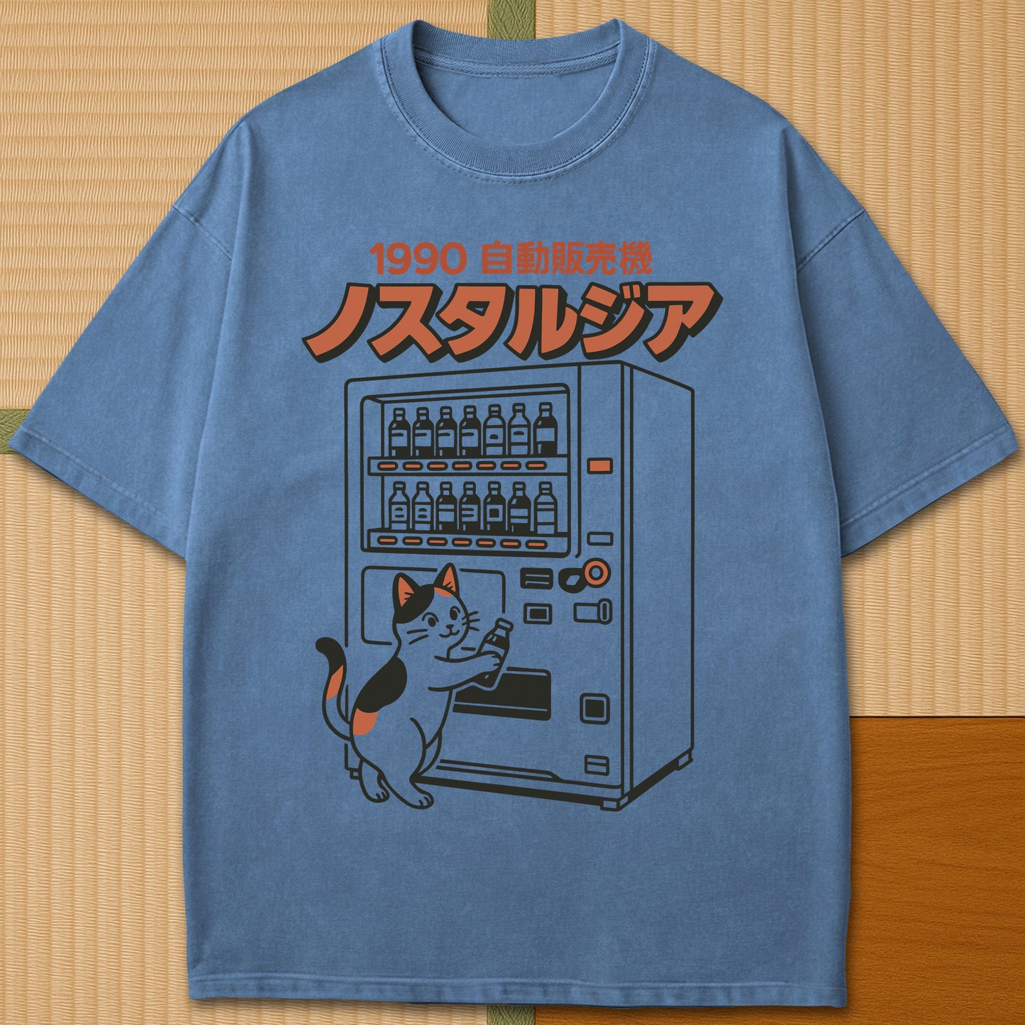 Japanese-inspired cotton Neko Nostalgia T-Shirt in Blue Jean on Comfort Colors 1717, styled in a modern flatlay scene.