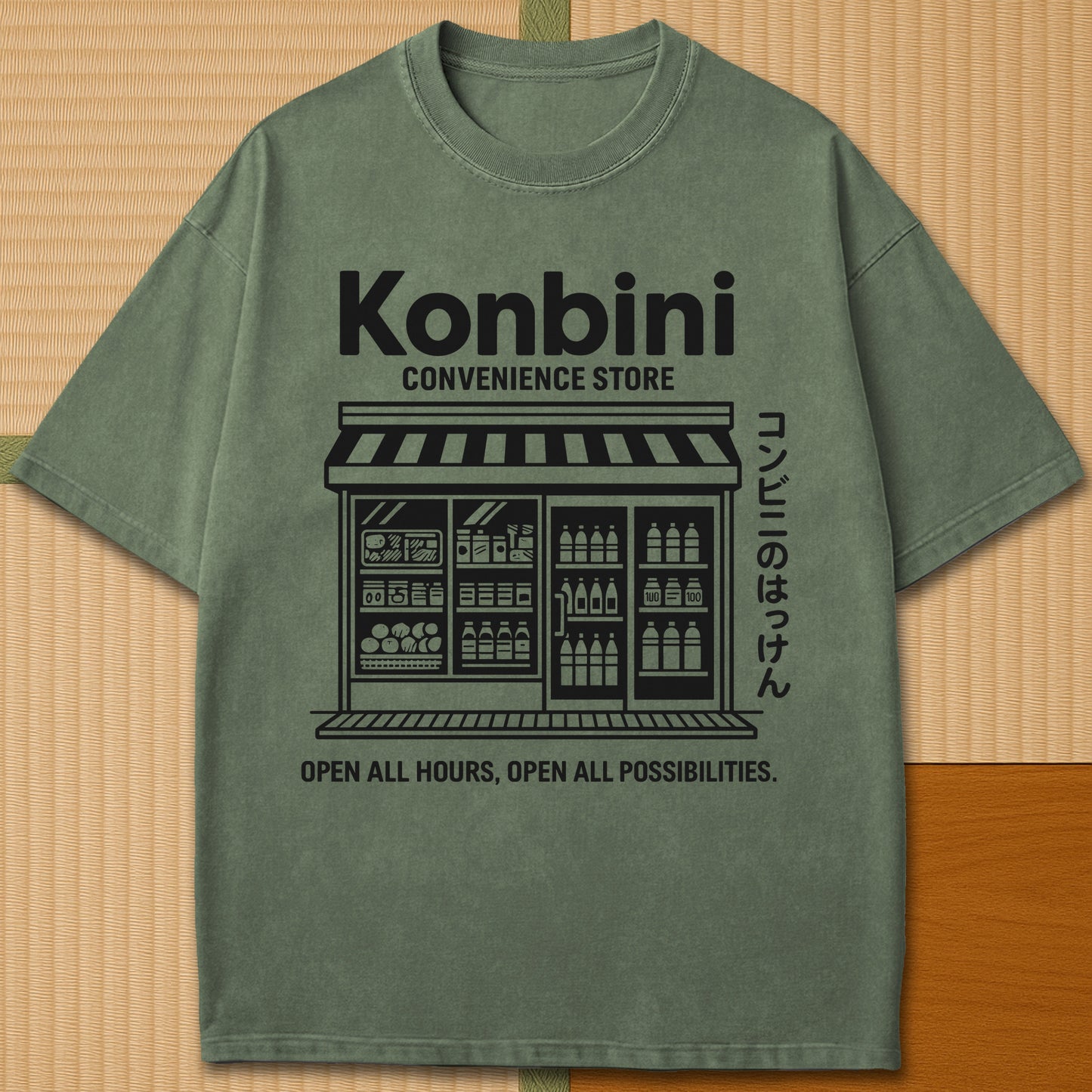 Japanese-inspired cotton Konbini Life T-Shirt in Moss on Comfort Colors 1717, styled in a modern flatlay scene.